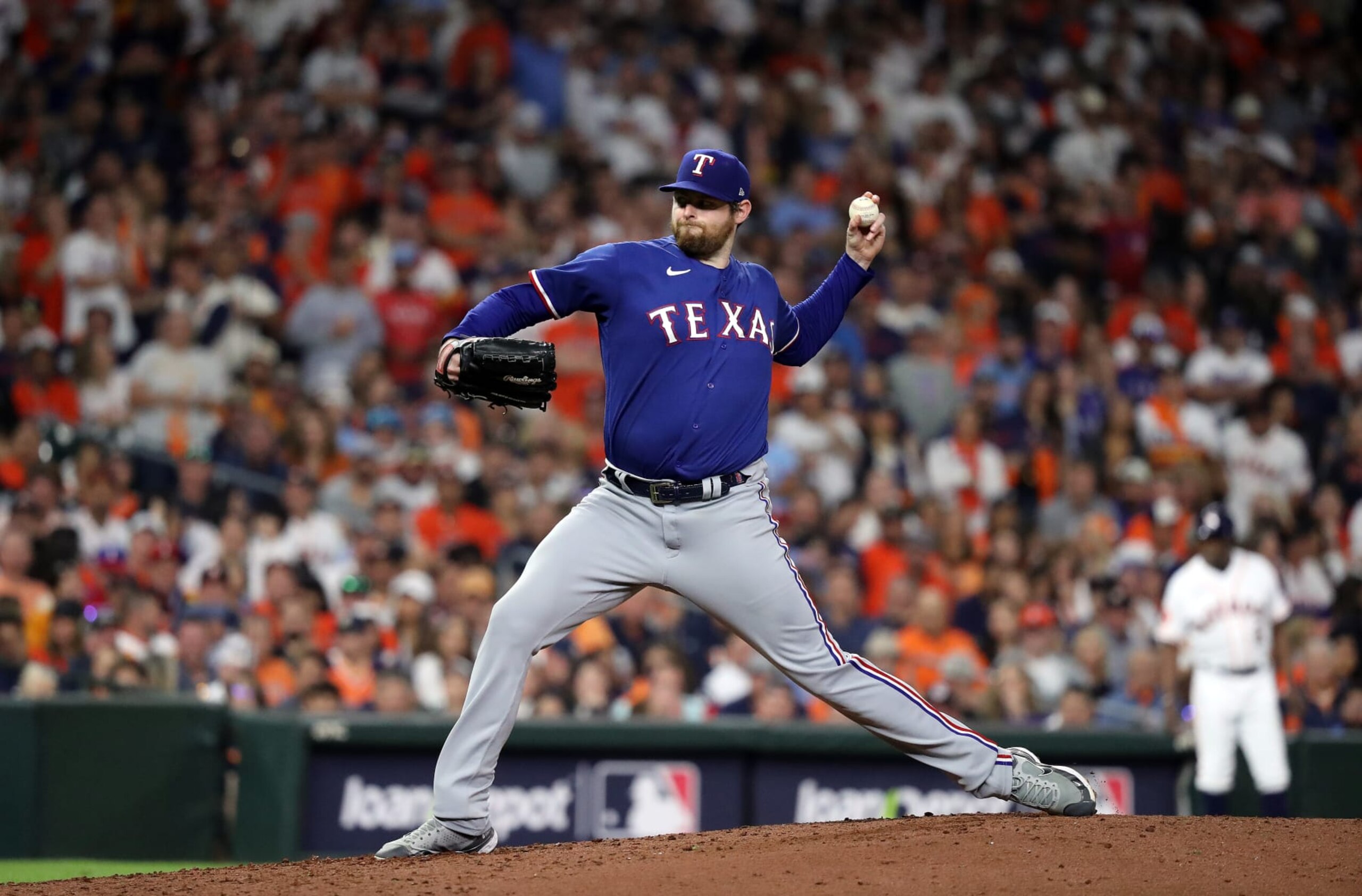 HOUSTON, TEXAS - OCTOBER 15: Jordan Montgomery #52 of the Texas Rangers pitches in the sixth inning against the Houston Astros during Game One of the American League Championship Series at Minute Maid Park on October 15, 2023 in Houston, Texas. (Photo by Bob Levey/Getty Images)