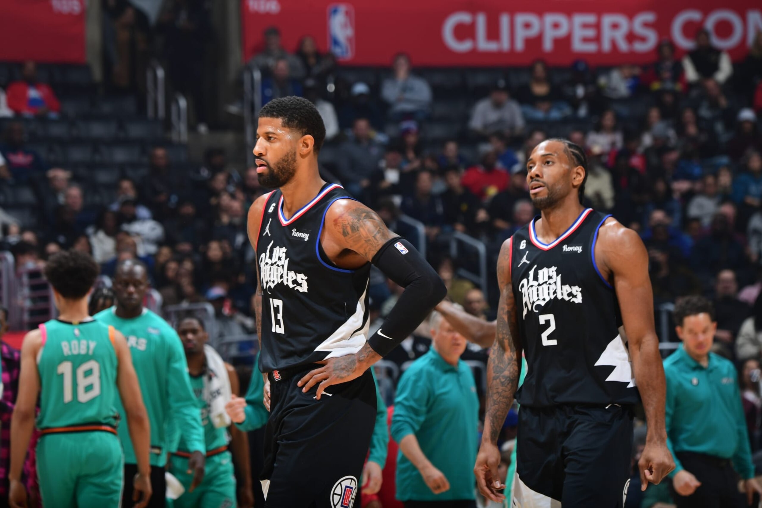 LOS ANGELES, CA - JANUARY 26: Paul George #13 and Kawhi Leonard #2 of the LA Clippers look on against the San Antonio Spurs on January 26, 2023 at Crypto.Com Arena in Los Angeles, California. NOTE TO USER: User expressly acknowledges and agrees that, by downloading and/or using this Photograph, user is consenting to the terms and conditions of the Getty Images License Agreement. Mandatory Copyright Notice: Copyright 2023 NBAE (Photo by Adam Pantozzi/NBAE via Getty Images)