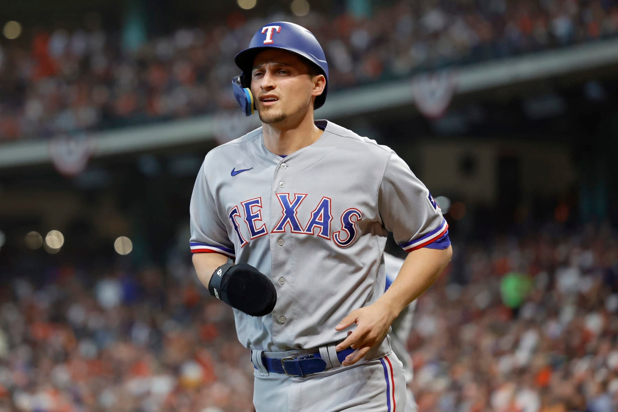 HOUSTON, TEXAS - OCTOBER 16: Corey Seager #5 of the Texas Rangers reacts after scoring a run against the Houston Astros during the first inning in Game Two of the American League Championship Series at Minute Maid Park on October 16, 2023 in Houston, Texas. (Photo by Carmen Mandato/Getty Images)