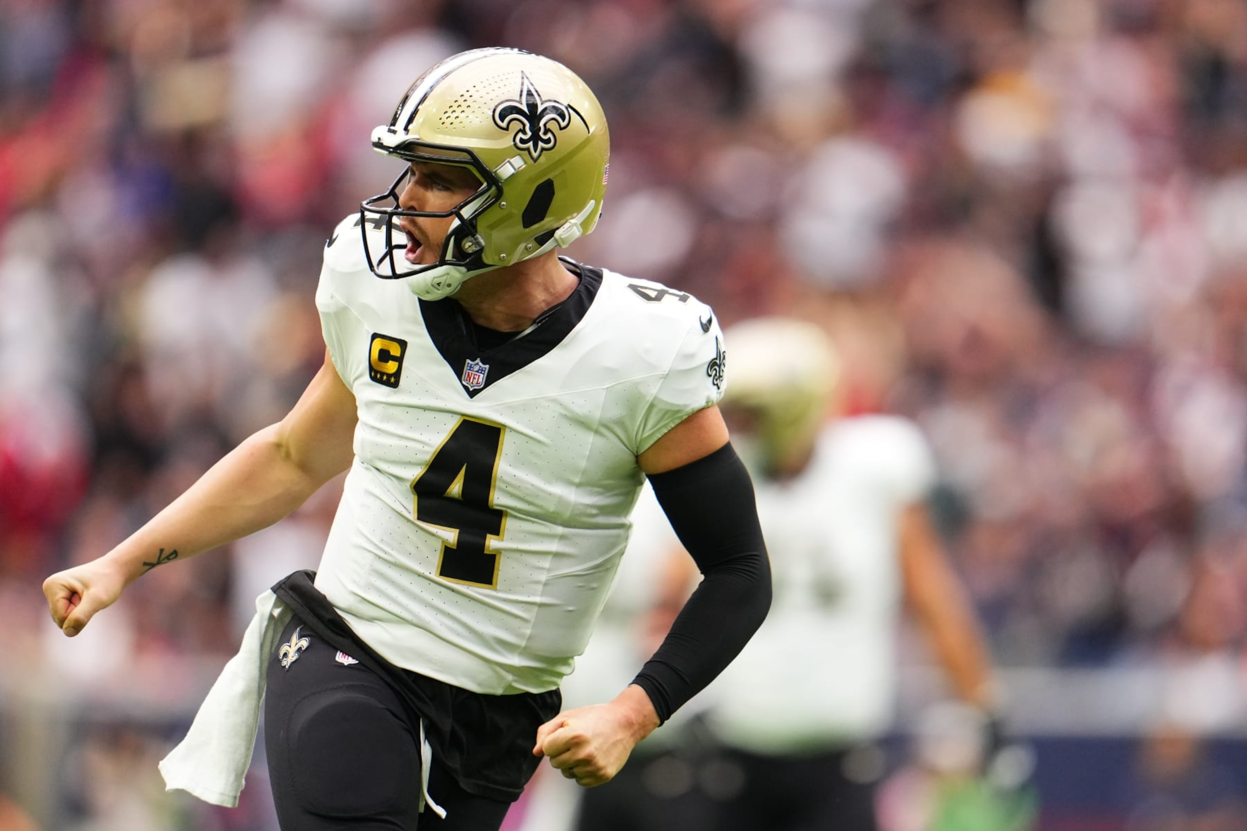 HOUSTON, TX - OCTOBER 15: Derek Carr #4 of the New Orleans Saints celebrates after scoring a touchdown against the Houston Texans during the first half at NRG Stadium on October 15, 2023 in Houston, Texas. (Photo by Cooper Neill/Getty Images)