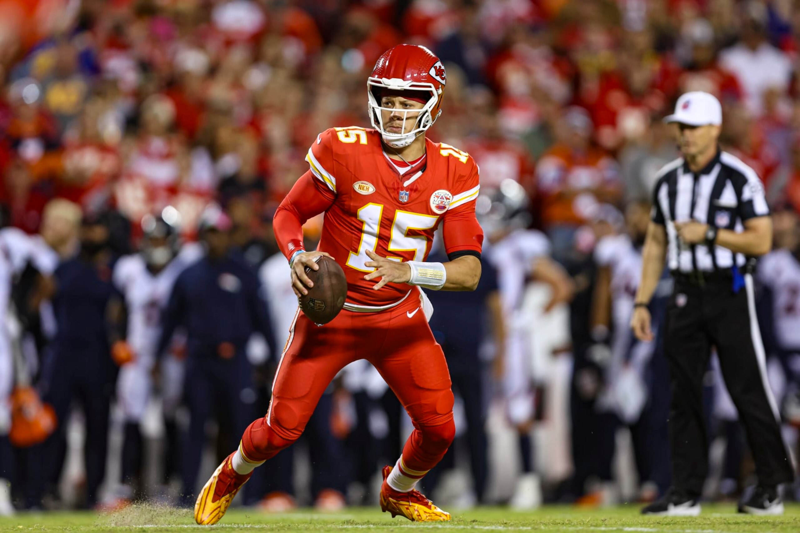 KANSAS CITY, MO - OCTOBER 12: Patrick Mahomes #15 of the Kansas City Chiefs scrambles out of the pocket during an NFL football game against the Denver Broncos at GEHA Field at Arrowhead Stadium on October 12, 2023 in Kansas City, Missouri. (Photo by Perry Knotts/Getty Images)