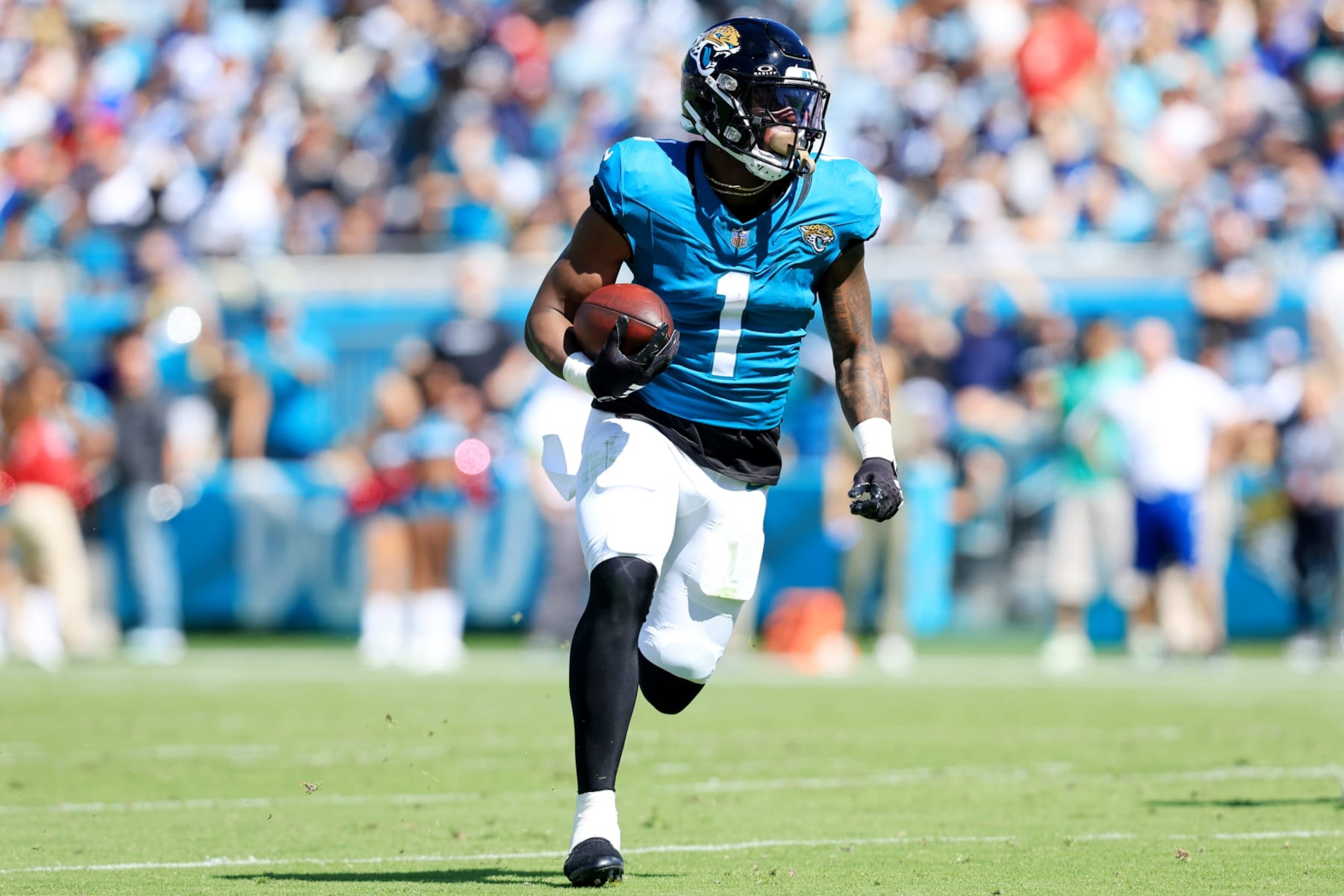 JACKSONVILLE, FLORIDA - OCTOBER 15: Travis Etienne Jr. #1 of the Jacksonville Jaguars runs with the ball during the second quarter against the Indianapolis Colts at EverBank Stadium on October 15, 2023 in Jacksonville, Florida. (Photo by Sam Greenwood/Getty Images)