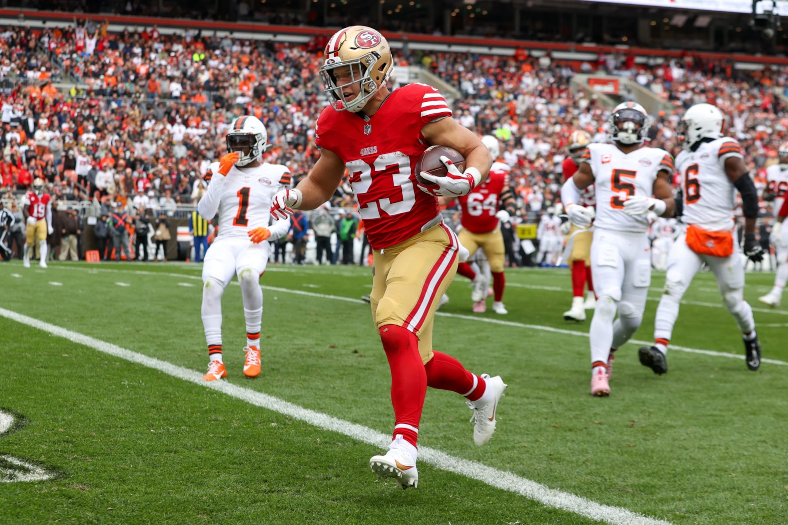 CLEVELAND, OH - OCTOBER 15: San Francisco 49ers running back Christian McCaffrey (23) scores on a 13-yard touchdown catch during the first quarter of the National Football League game between the San Francisco 49ers and Cleveland Browns on October 15, 2023, at Cleveland Browns Stadium in Cleveland, OH. (Photo by Frank Jansky/Icon Sportswire via Getty Images)