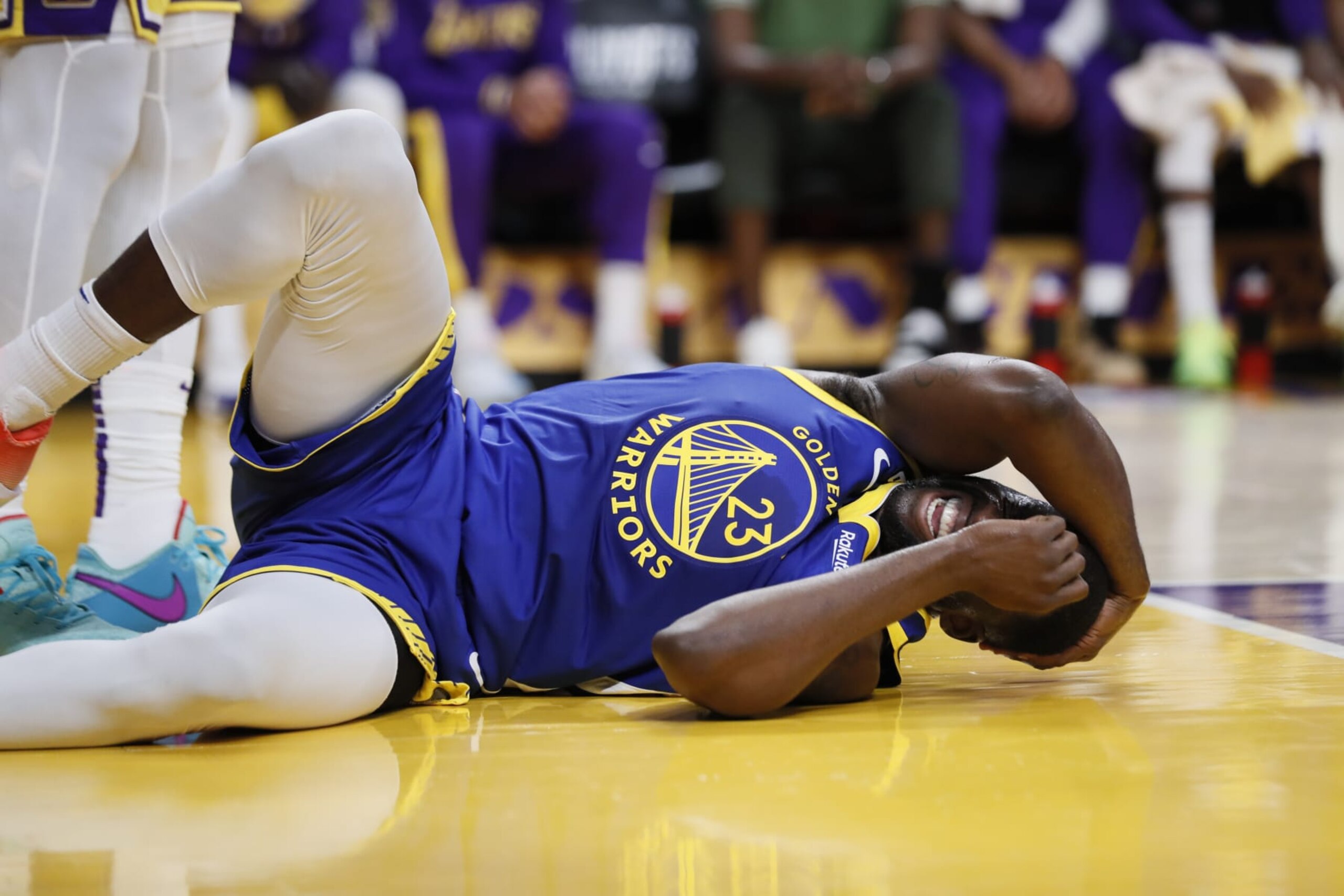 Los Angeles, CA, Monday, May 8, 2023 - Golden State Warriors forward Draymond Green (23) grimaces in pain after hitting his head on the court in game four of the NBA Western Conference Finals at Crypto.com Arena. (Robert Gauthier/Los Angeles Times via Getty Images)