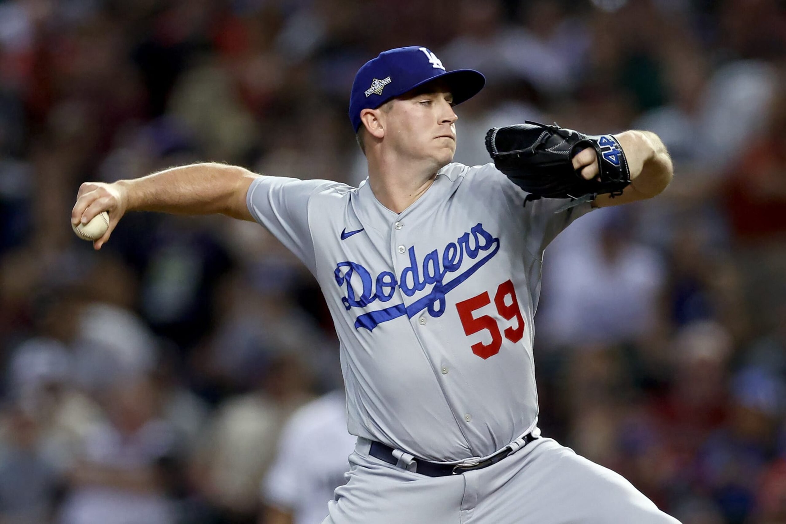 PHOENIX, ARIZONA - OCTOBER 11: Evan Phillips #59 of the Los Angeles Dodgers pitches in the eighth inning against the Arizona Diamondbacks during Game Three of the Division Series at Chase Field on October 11, 2023 in Phoenix, Arizona. (Photo by Elsa/Getty Images)
