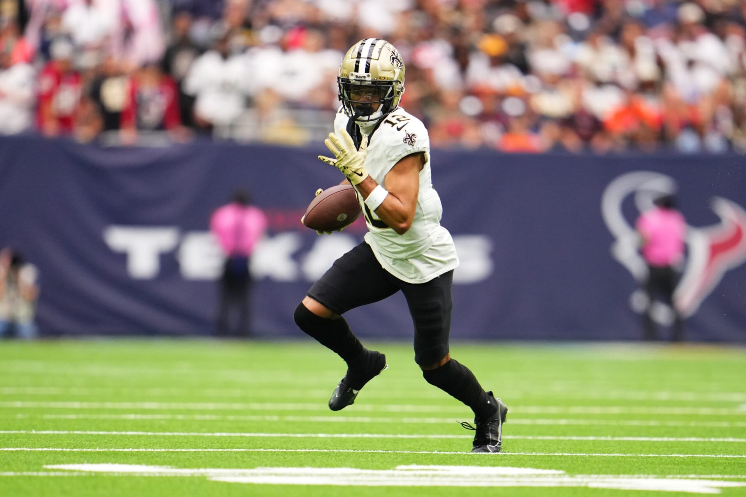 HOUSTON, TX - OCTOBER 15: Chris Olave #12 of the New Orleans Saints runs with the ball against the Houston Texans during the second half at NRG Stadium on October 15, 2023 in Houston, Texas. (Photo by Cooper Neill/Getty Images)