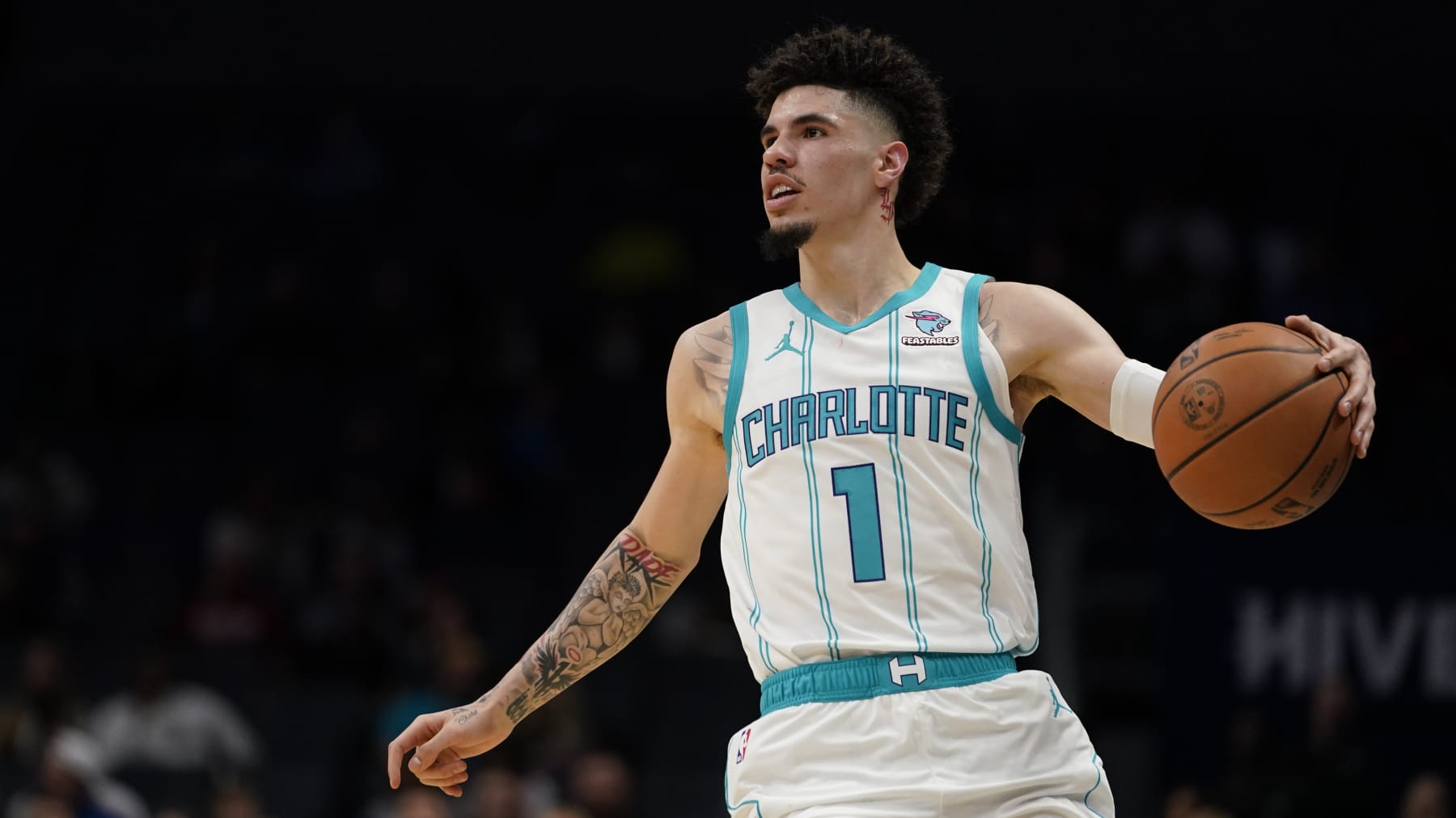 Charlotte Hornets guard LaMelo Ball dribbles the ball in the first half of an NBA basketball preseason game against the Oklahoma City Thunder, Sunday, Oct. 15, 2023, in Charlotte, N.C. (AP Photo/Erik Verduzco)