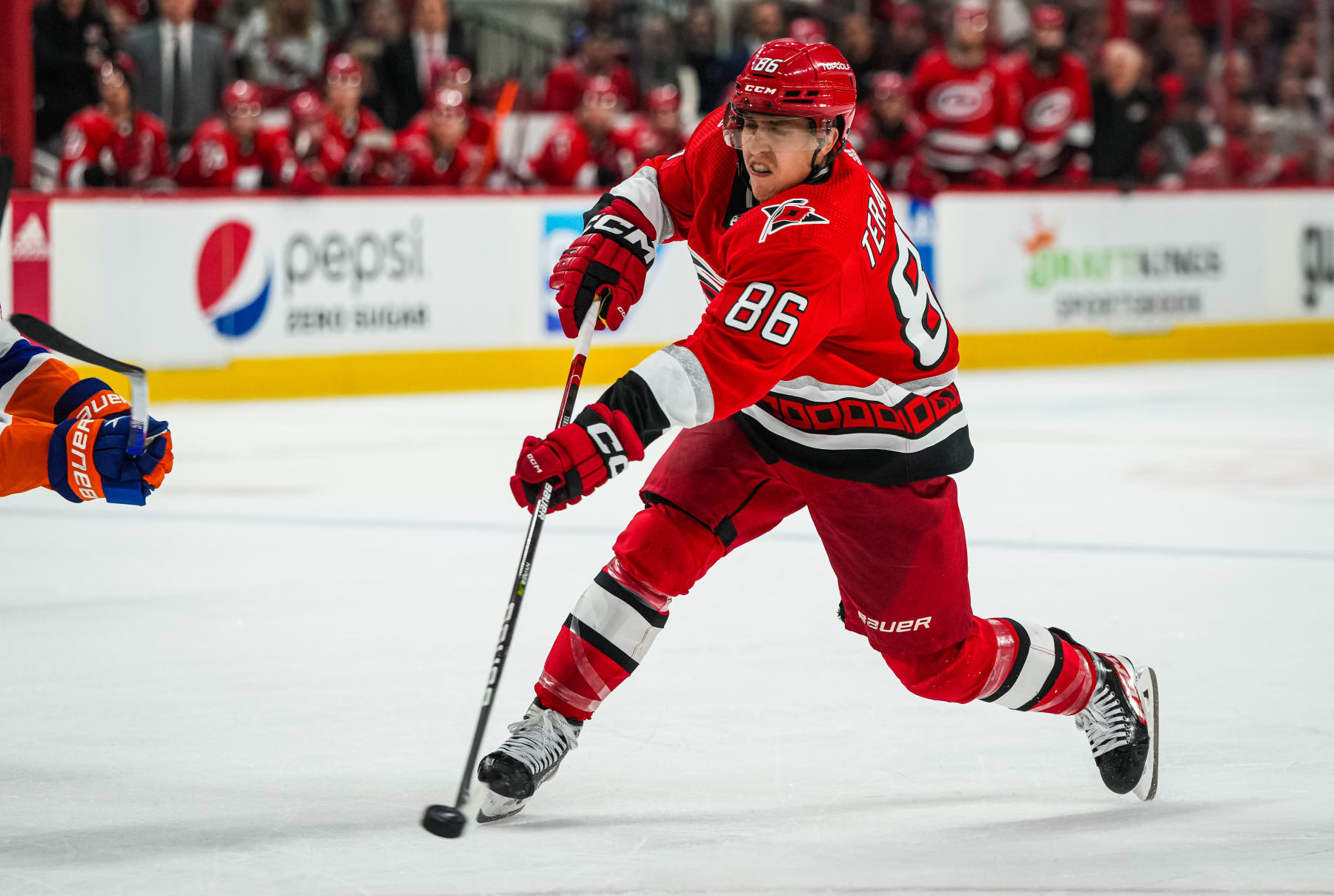 RALEIGH, NORTH CAROLINA - APRIL 19: Teuvo Teravainen #86 of the Carolina Hurricanes shoots the puck during the third period against the New York Islanders in Game Two of the First Round of the 2023 Stanley Cup Playoffs at PNC Arena on April 19, 2023 in Raleigh, North Carolina. (Photo by Josh Lavallee/NHLI via Getty Images)