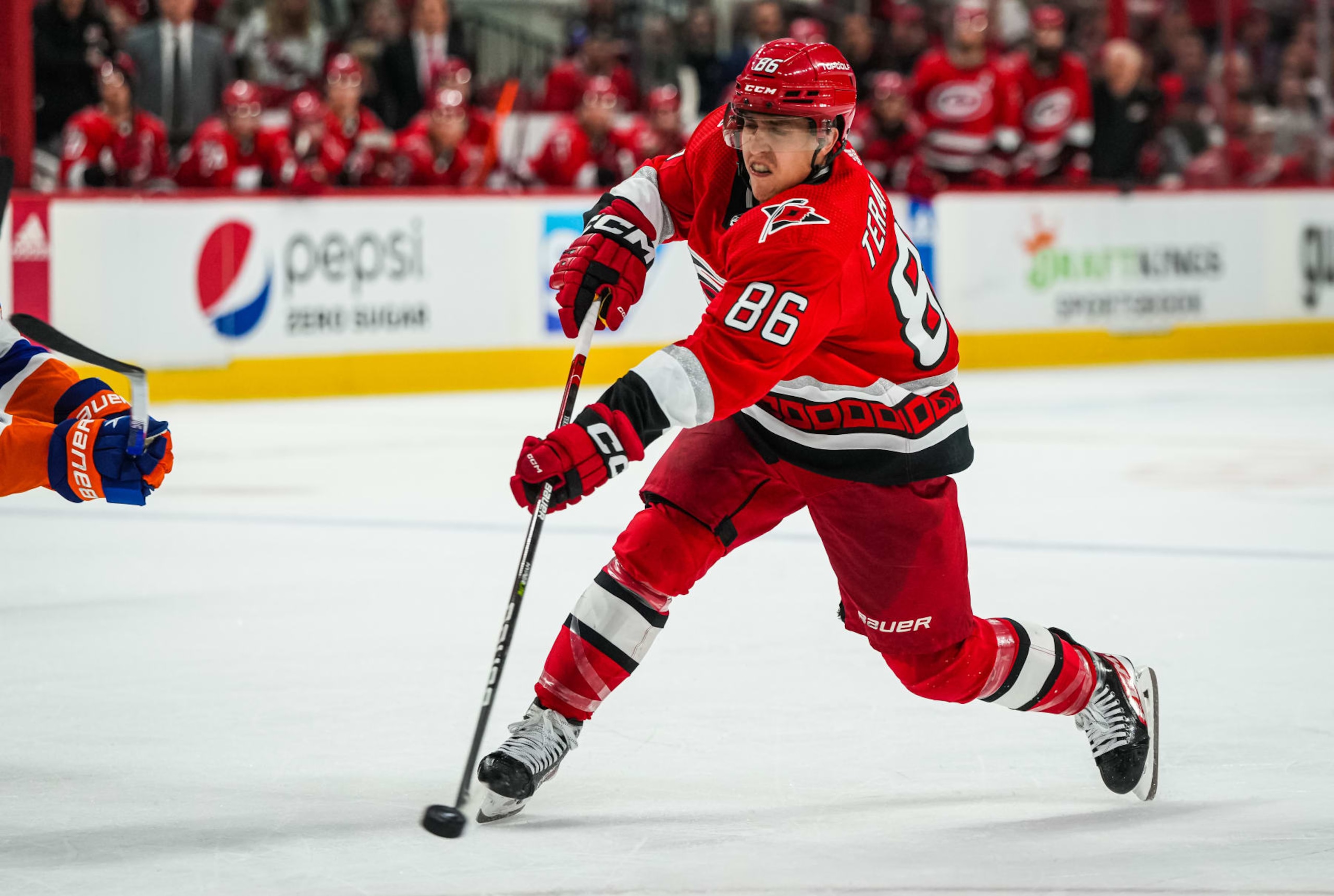 RALEIGH, NORTH CAROLINA - APRIL 19: Teuvo Teravainen #86 of the Carolina Hurricanes shoots the puck during the third period against the New York Islanders in Game Two of the First Round of the 2023 Stanley Cup Playoffs at PNC Arena on April 19, 2023 in Raleigh, North Carolina. (Photo by Josh Lavallee/NHLI via Getty Images)