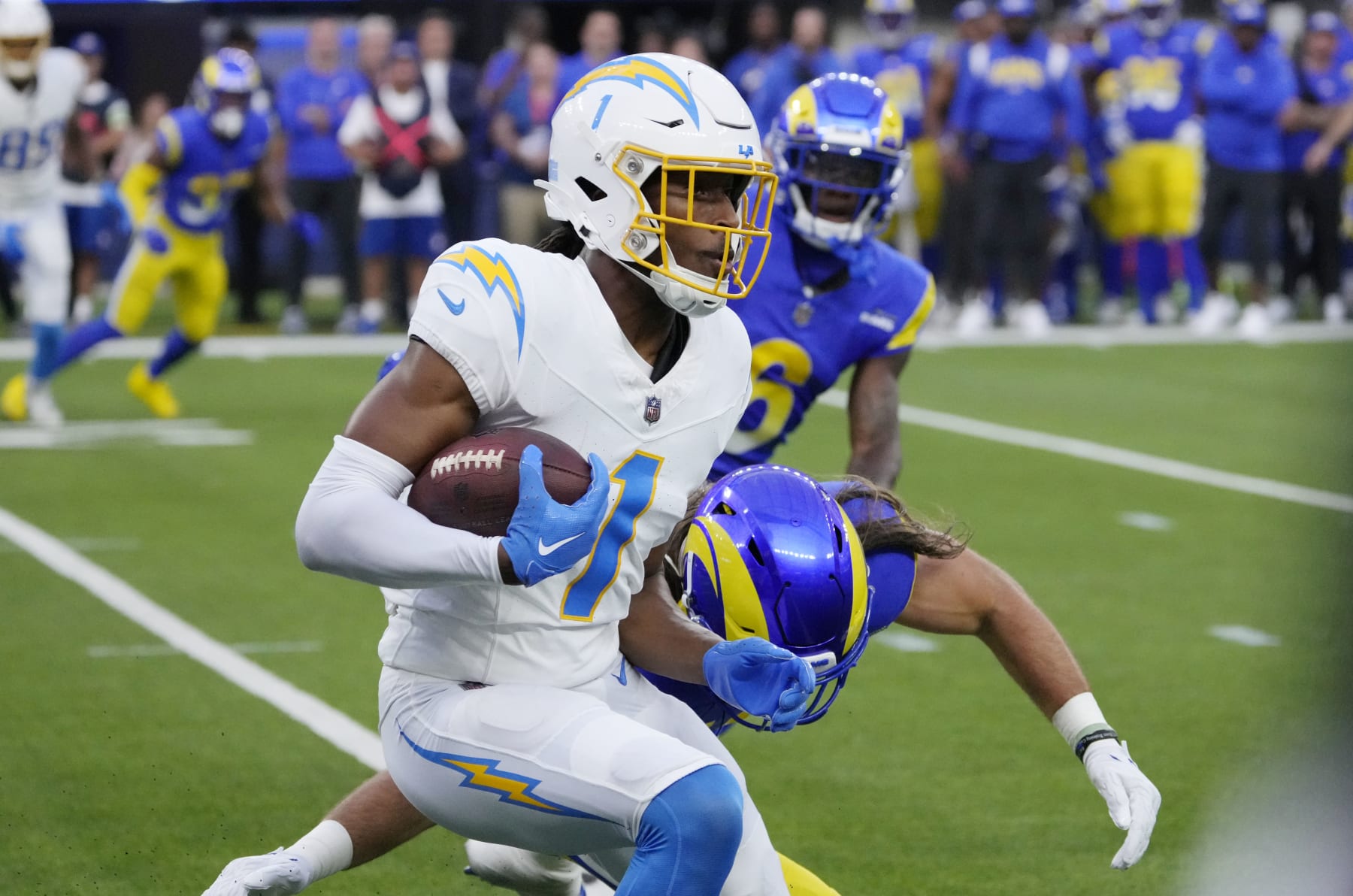 INGLEWOOD, CALIFORNIA - AUGUST 12: Wide receiver Quentin Johnston #1 of the Los Angeles Chargers catches a pass and runs against the Los Angeles Rams during the first half of pre-season NFL game at SoFi Stadium on August 12, 2023 in Inglewood, California. (Photo by Kevork Djansezian/Getty Images)