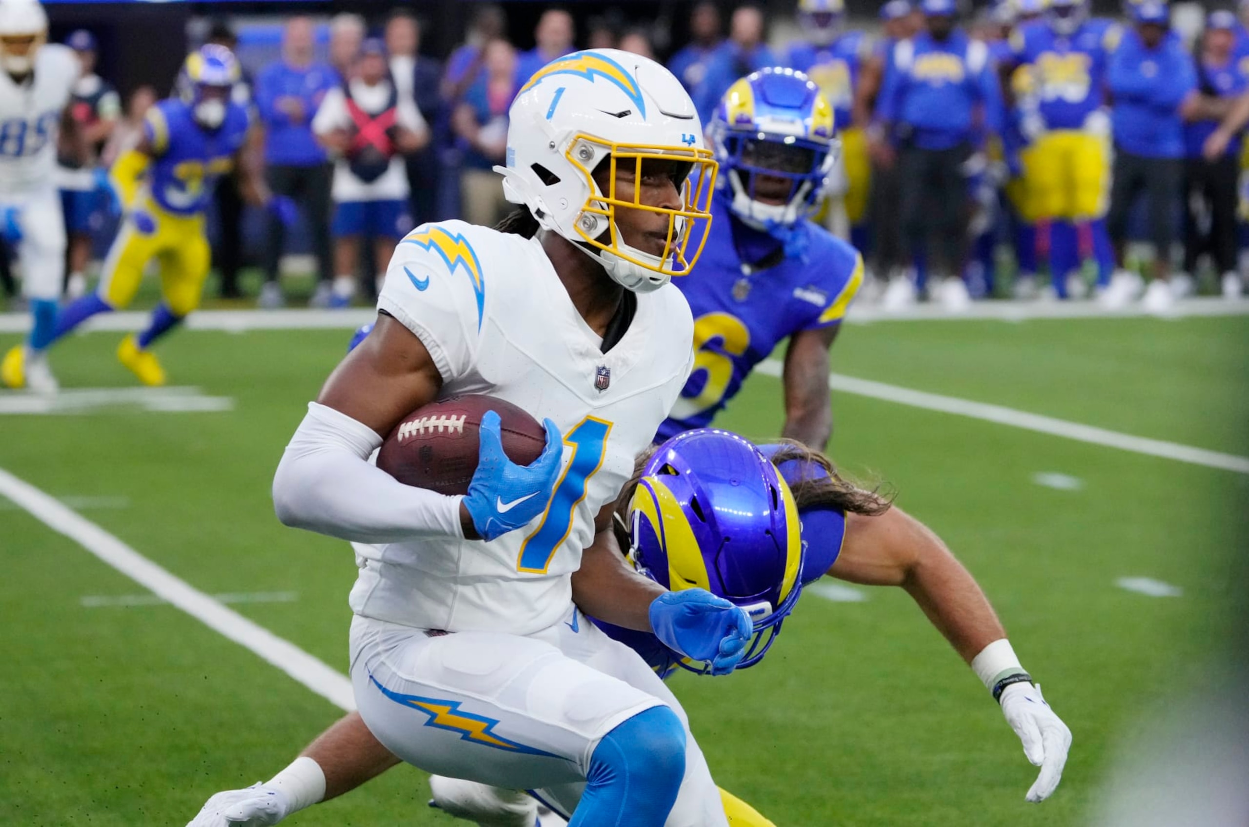 INGLEWOOD, CALIFORNIA - AUGUST 12: Wide receiver Quentin Johnston #1 of the Los Angeles Chargers catches a pass and runs against the Los Angeles Rams during the first half of pre-season NFL game at SoFi Stadium on August 12, 2023 in Inglewood, California. (Photo by Kevork Djansezian/Getty Images)