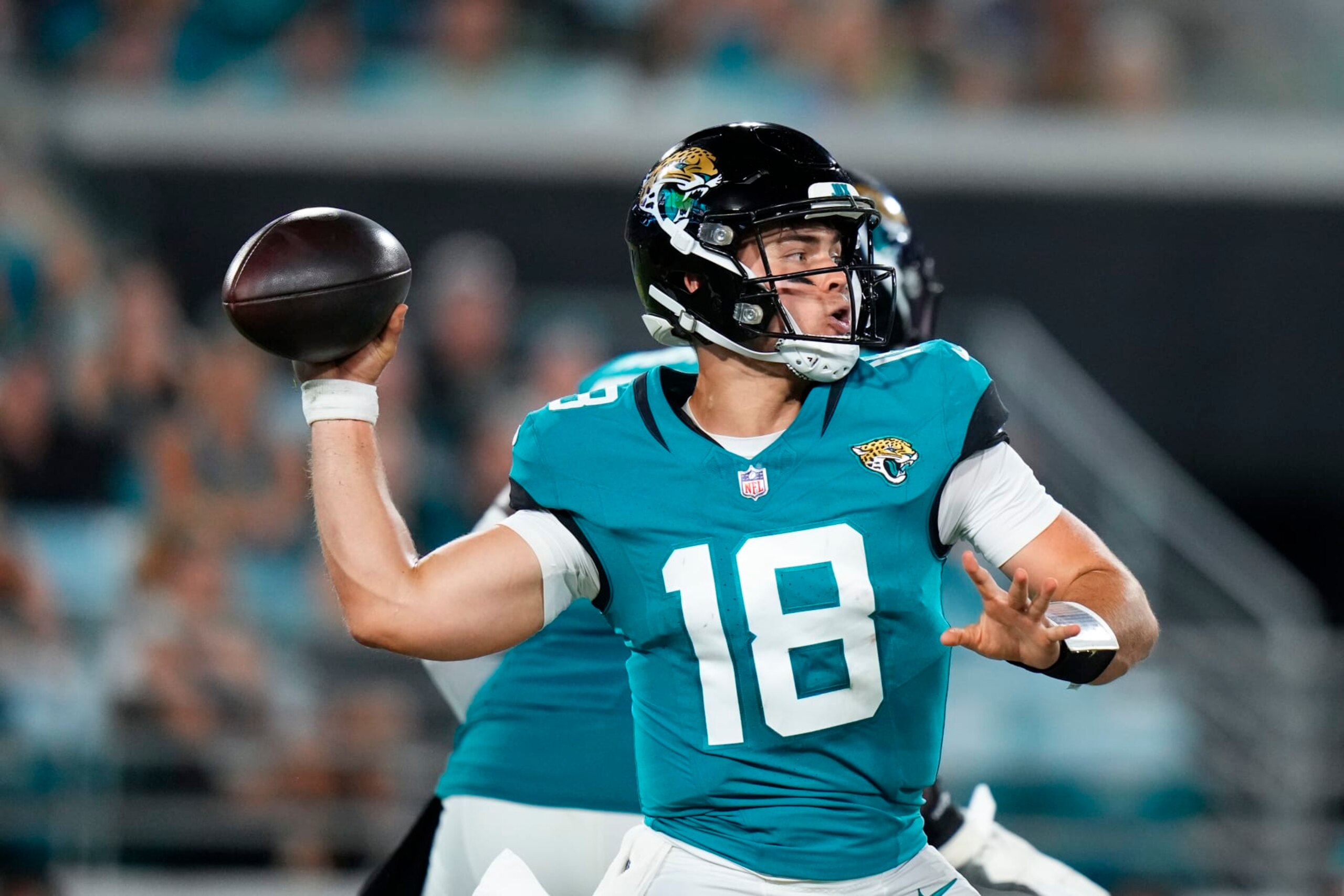 JACKSONVILLE, FLORIDA - AUGUST 26: Nathan Rourke #18 of the Jacksonville Jaguars throws a pass against the Miami Dolphins during the second half at EverBank Stadium on August 26, 2023 in Jacksonville, Florida. (Photo by Rich Storry/Getty Images)
