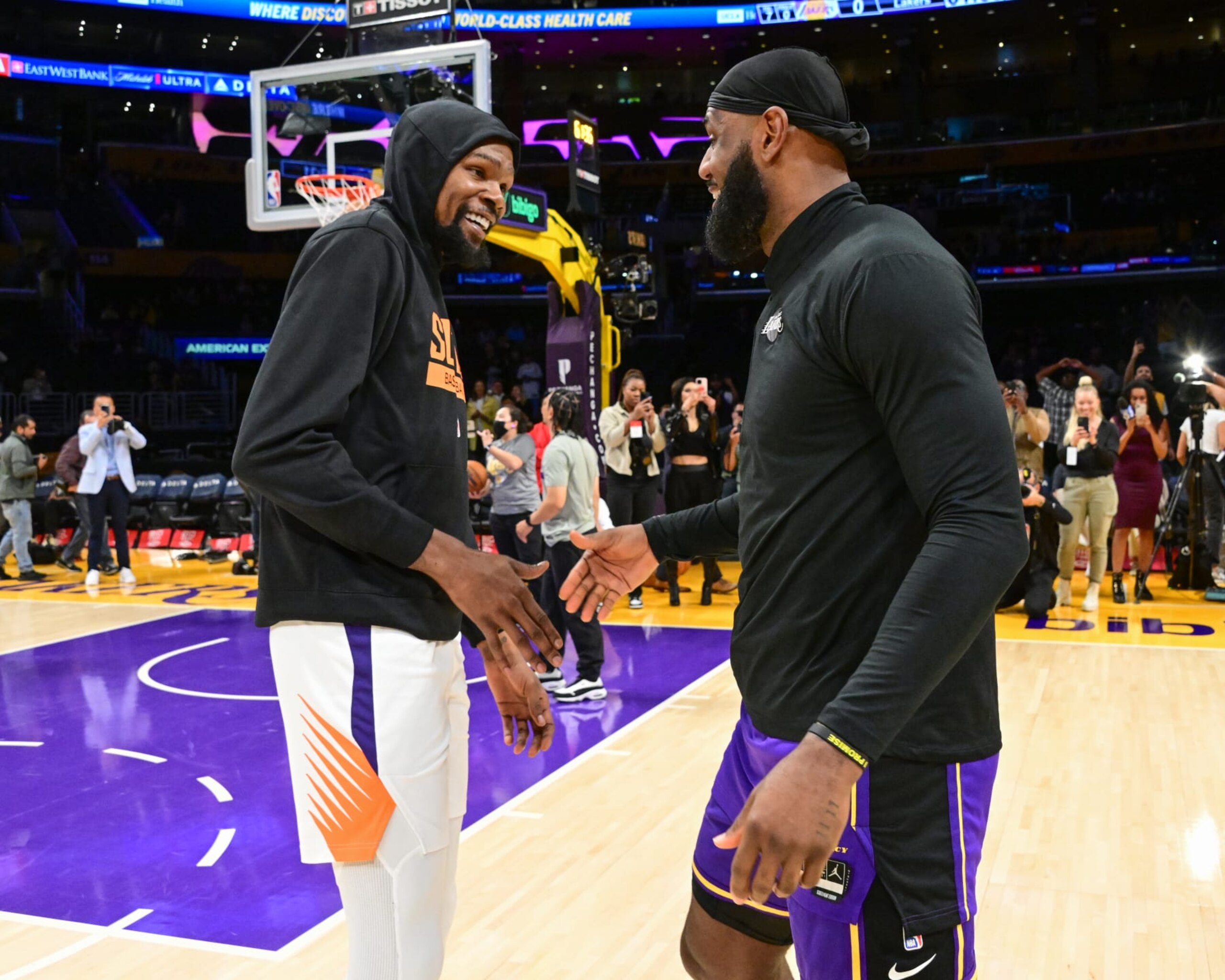 LOS ANGELES, CA - APRIL 7:  LeBron James #6 of the Los Angeles Lakers and Kevin Durant #35 of the Phoenix Suns embrace before the game on April 7, 2023 at Crypto.Com Arena in Los Angeles, California. NOTE TO USER: User expressly acknowledges and agrees that, by downloading and/or using this Photograph, user is consenting to the terms and conditions of the Getty Images License Agreement. Mandatory Copyright Notice: Copyright 2023 NBAE (Photo by Adam Pantozzi/NBAE via Getty Images)