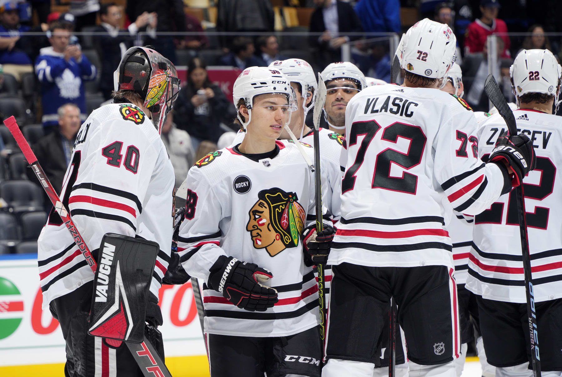 TORONTO, ON - OCTOBER 16:  Connor Bedard #98 of the Chicago Blackhawks celebrates the win with Arvid Soderblom #40 against the Toronto Maple Leafs at the Scotiabank Arena on October 16, 2023 in Toronto, Ontario, Canada.  (Photo by Kevin Sousa/NHLI via Getty Images)