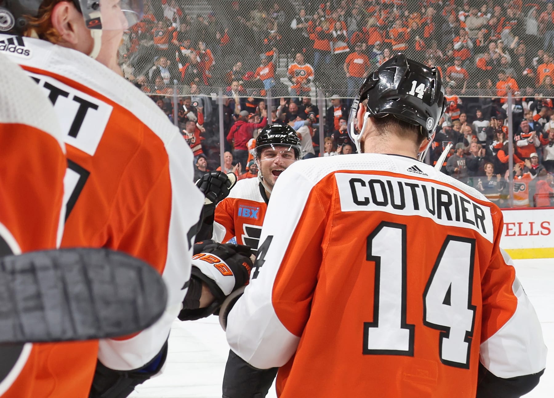 PHILADELPHIA, PENNSYLVANIA - OCTOBER 17: Scott Laughton #21 of the Philadelphia Flyers reacts while celebrating the first period penalty-shot goal scored by teammate Sean Couturier #14 against the Vancouver Canucks at the Wells Fargo Center on October 17, 2023 in Philadelphia, Pennsylvania.  (Photo by Len Redkoles/NHLI via Getty Images)
