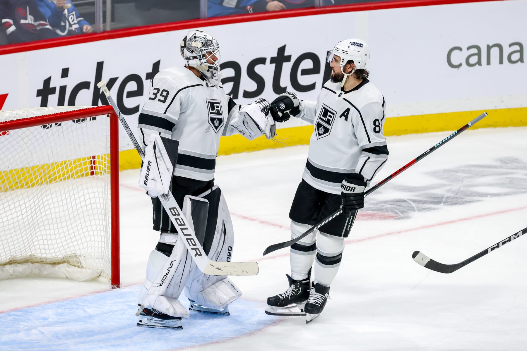 WINNIPEG, CANADA - OCTOBER 17: Goaltender Cam Talbot #39 and Drew Doughty #8 of the Los Angeles Kings celebrate following a 5-1 victory over the Winnipeg Jets at the Canada Life Centre on October 17, 2023 in Winnipeg, Manitoba, Canada. (Photo by Jonathan Kozub/NHLI via Getty Images)