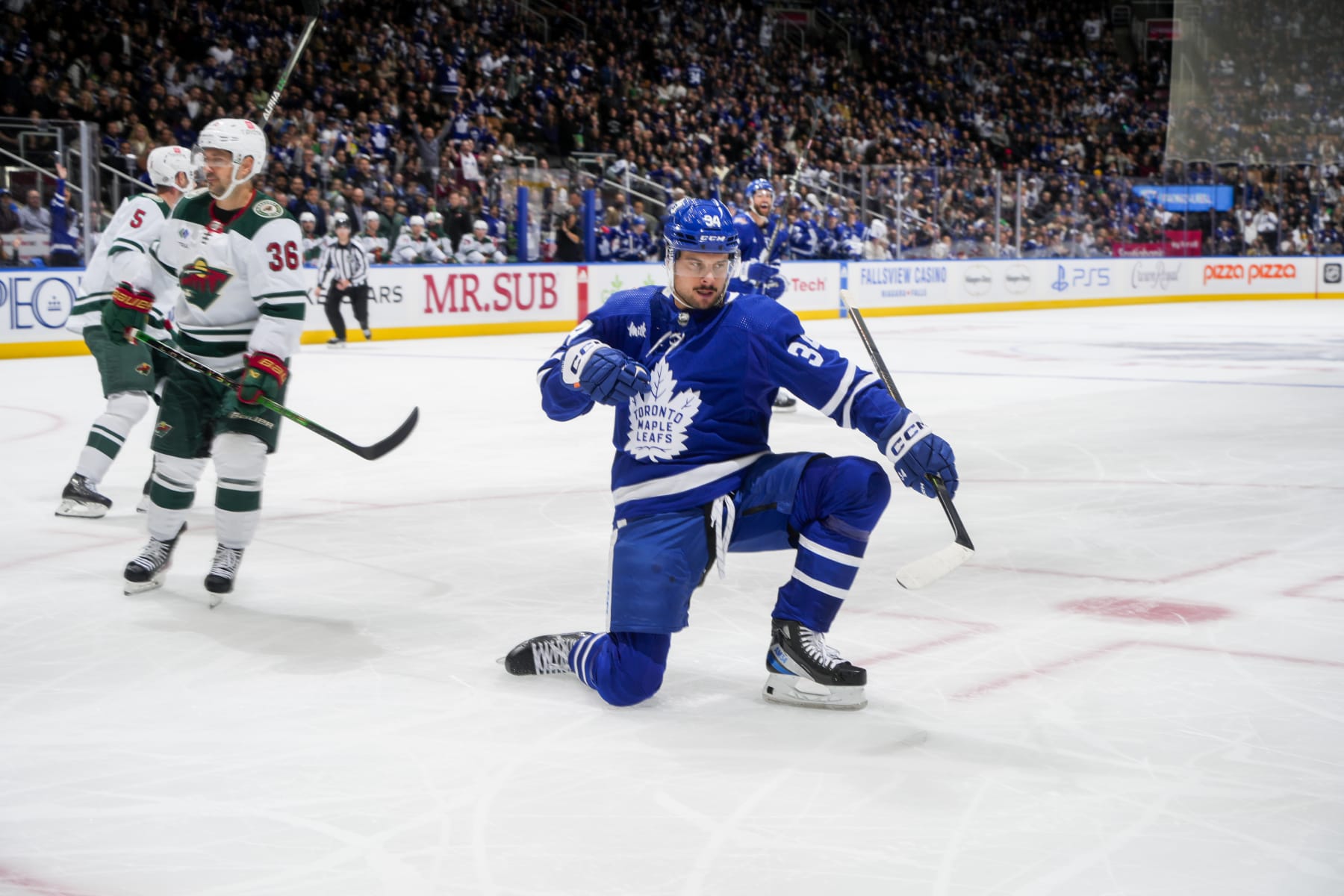 TORONTO, ON - OCTOBER 14: Auston Matthews #34 of the Toronto Maple Leafs celebrates his goal against the Minnesota Wild during the first period at the Scotiabank Arena on October 14, 2023 in Toronto, Ontario, Canada. (Photo by Mark Blinch/NHLI via Getty Images)