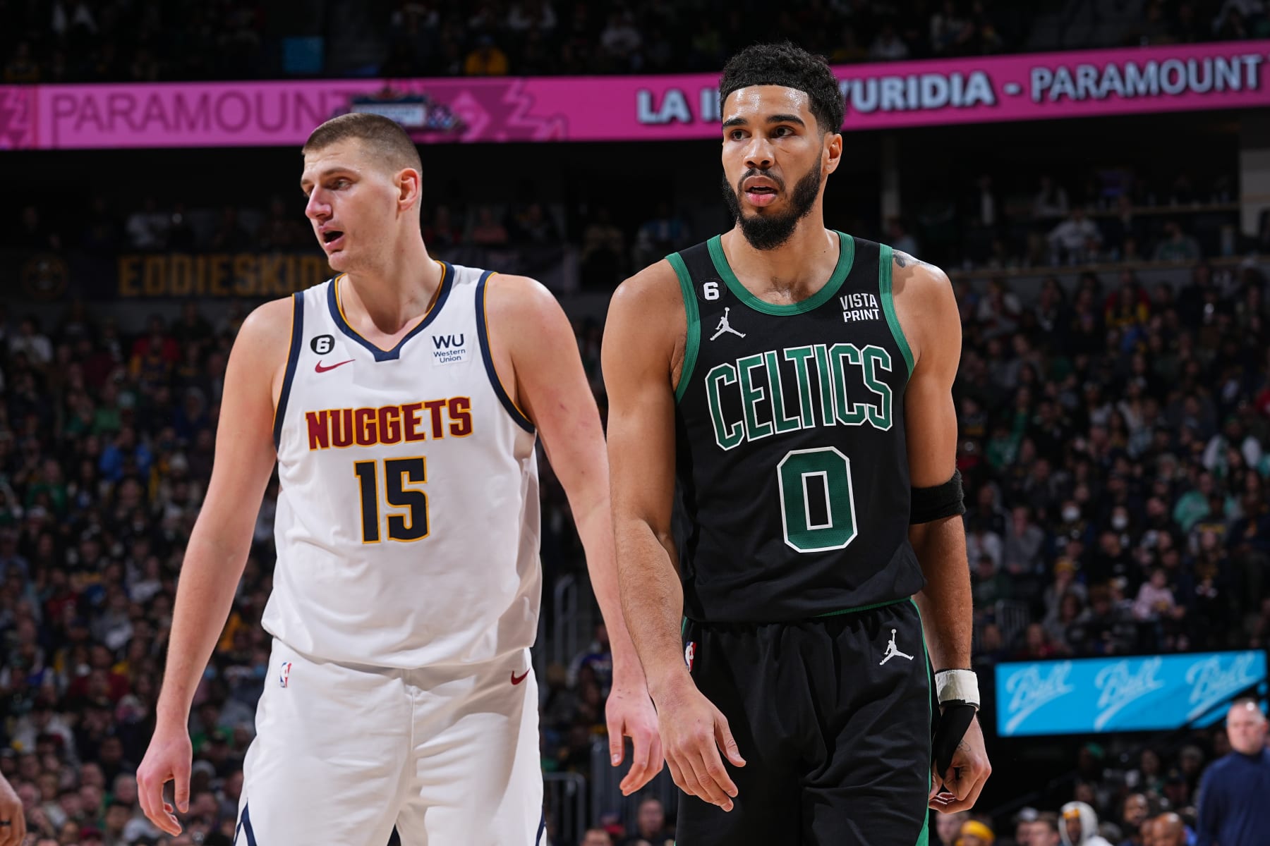 DENVER, CO - JANUARY 1: Opponents Nikola Jokic #15 of the Denver Nuggets and Jayson Tatum #0 of the Boston Celtics stand on the court during the game on January 1, 2023 at the Ball Arena in Denver, Colorado. NOTE TO USER: User expressly acknowledges and agrees that, by downloading and/or using this Photograph, user is consenting to the terms and conditions of the Getty Images License Agreement. Mandatory Copyright Notice: Copyright 2022 NBAE (Photo by Bart Young/NBAE via Getty Images)