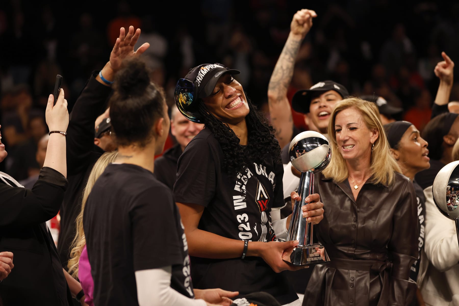 NEW YORK, NEW YORK - OCTOBER 18: A'ja Wilson #22 of the Las Vegas Aces celebrates with the MVP trophy after defeating the New York Liberty during Game Four of the 2023 WNBA Finals at Barclays Center on October 18, 2023 in New York City. The Aces defeated the Liberty 70-69. (Photo by Sarah Stier/Getty Images)