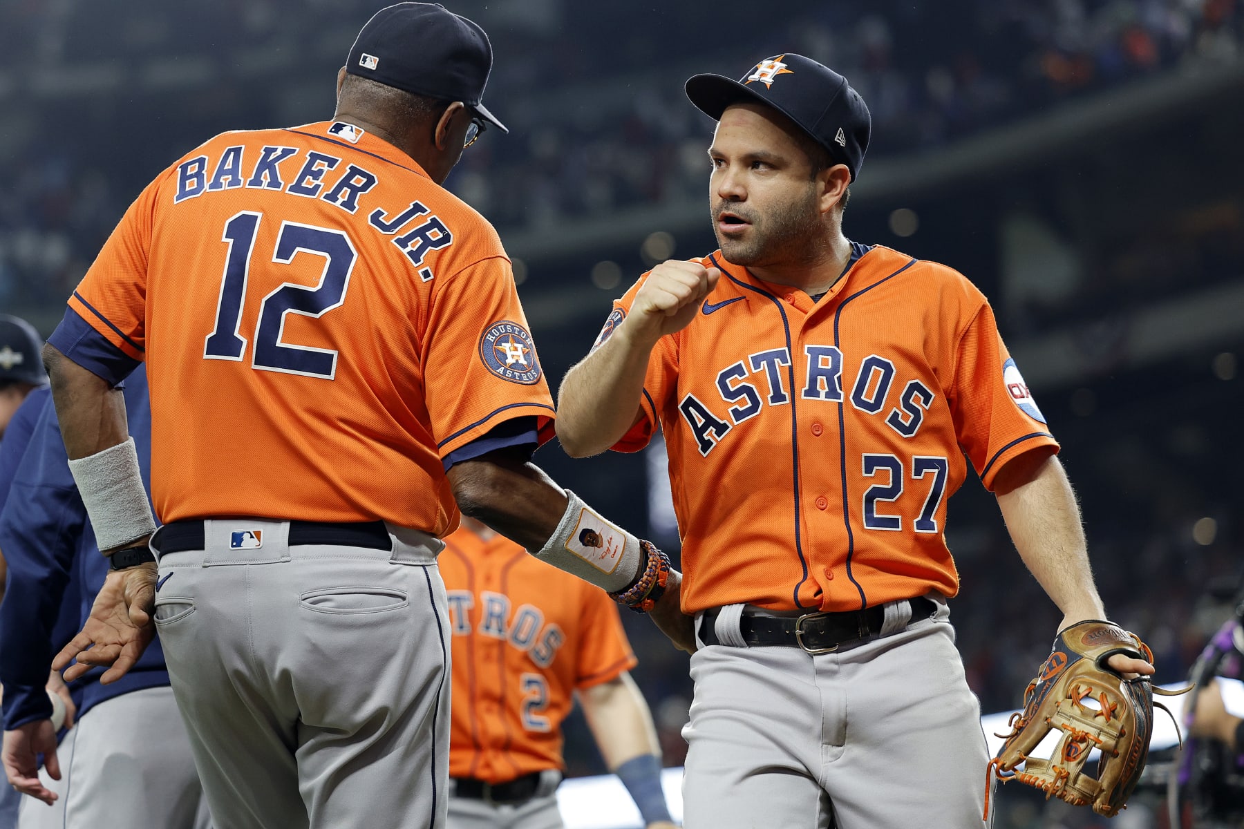 ARLINGTON, TEXAS - OCTOBER 18: Jose Altuve #27 of the Houston Astros celebrates with manager Dusty Baker #12 after defeating the Texas Rangers in Game Three of the American League Championship Series at Globe Life Field on October 18, 2023 in Arlington, Texas. (Photo by Carmen Mandato/Getty Images)