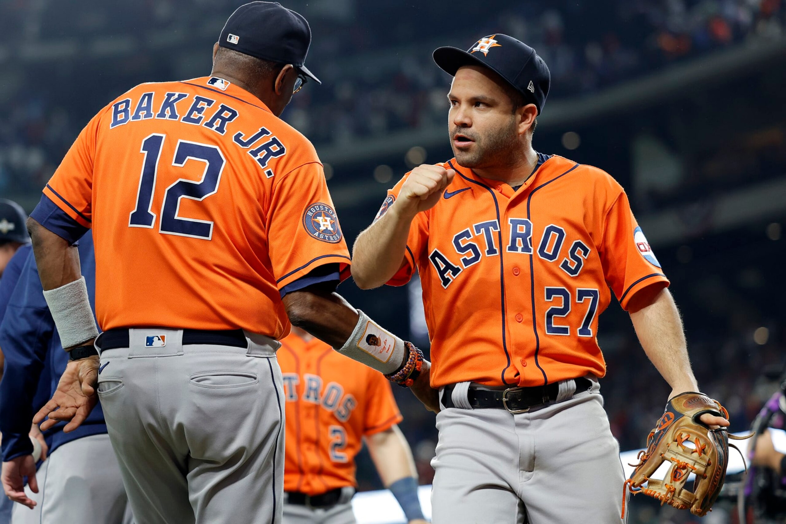 ARLINGTON, TEXAS - OCTOBER 18: Jose Altuve #27 of the Houston Astros celebrates with manager Dusty Baker #12 after defeating the Texas Rangers in Game Three of the American League Championship Series at Globe Life Field on October 18, 2023 in Arlington, Texas. (Photo by Carmen Mandato/Getty Images)