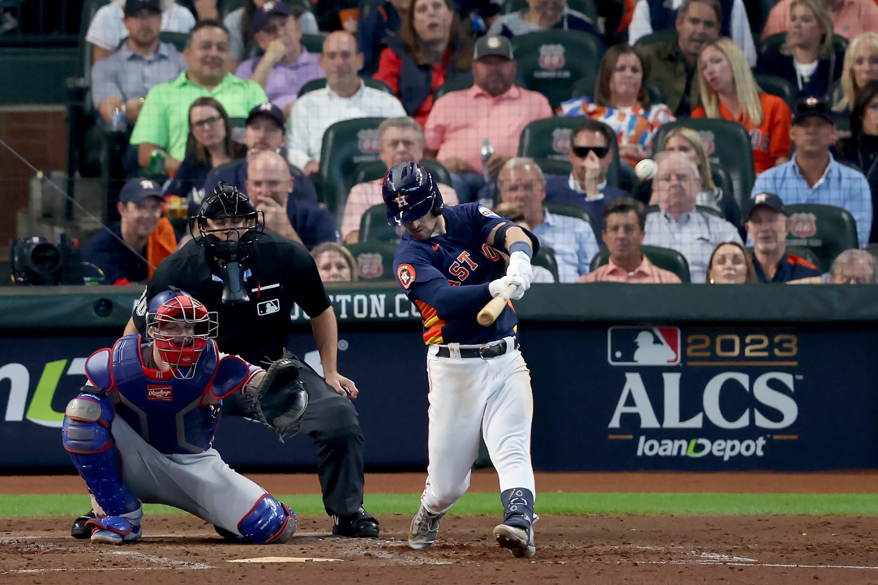 HOUSTON, TEXAS - OCTOBER 16: Alex Bregman #2 of the Houston Astros hits a solo home run against Nathan Eovaldi #17 of the Texas Rangers during the fourth inning in Game Two of the American League Championship Series at Minute Maid Park on October 16, 2023 in Houston, Texas. (Photo by Rob Carr/Getty Images)