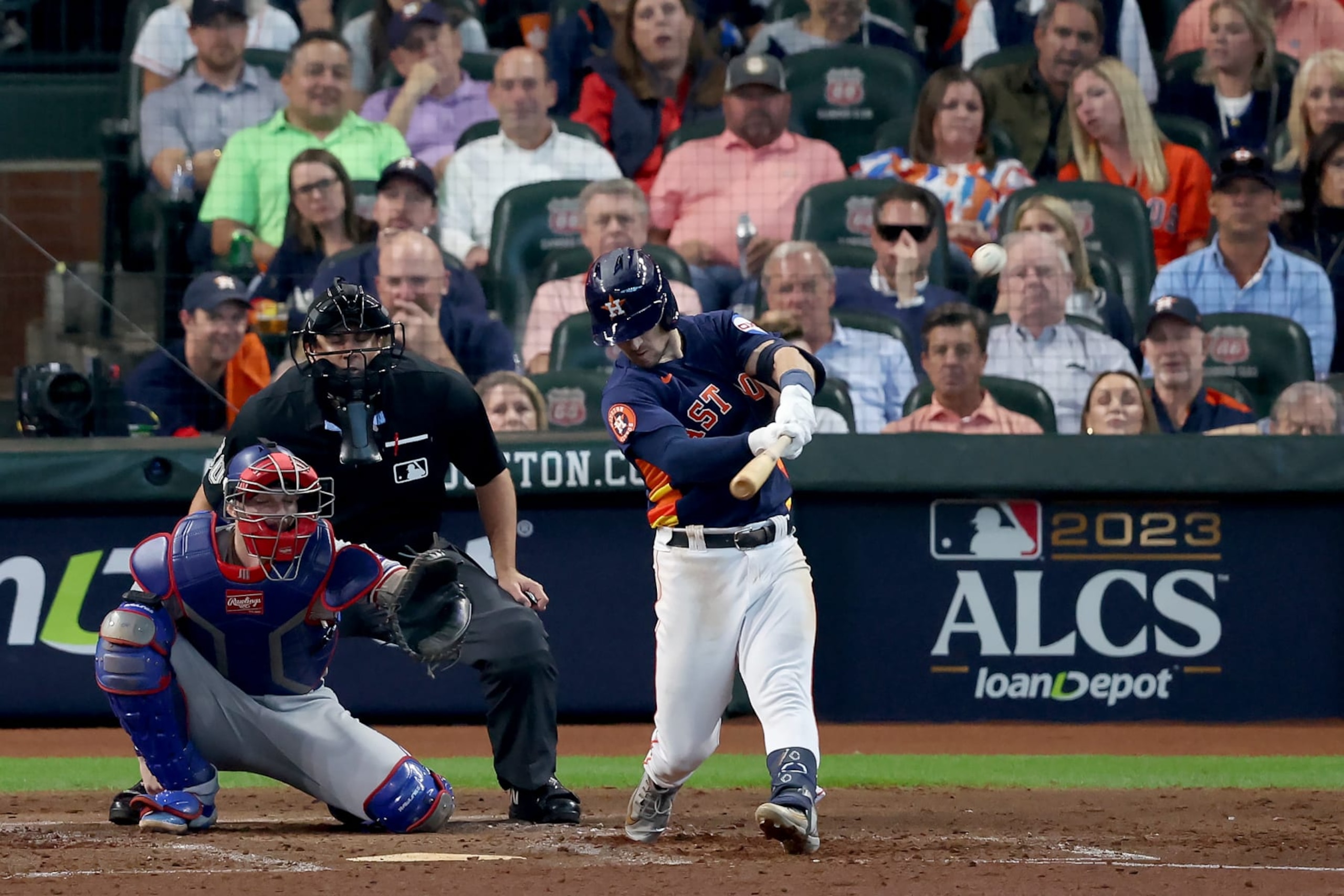 HOUSTON, TEXAS - OCTOBER 16: Alex Bregman #2 of the Houston Astros hits a solo home run against Nathan Eovaldi #17 of the Texas Rangers during the fourth inning in Game Two of the American League Championship Series at Minute Maid Park on October 16, 2023 in Houston, Texas. (Photo by Rob Carr/Getty Images)
