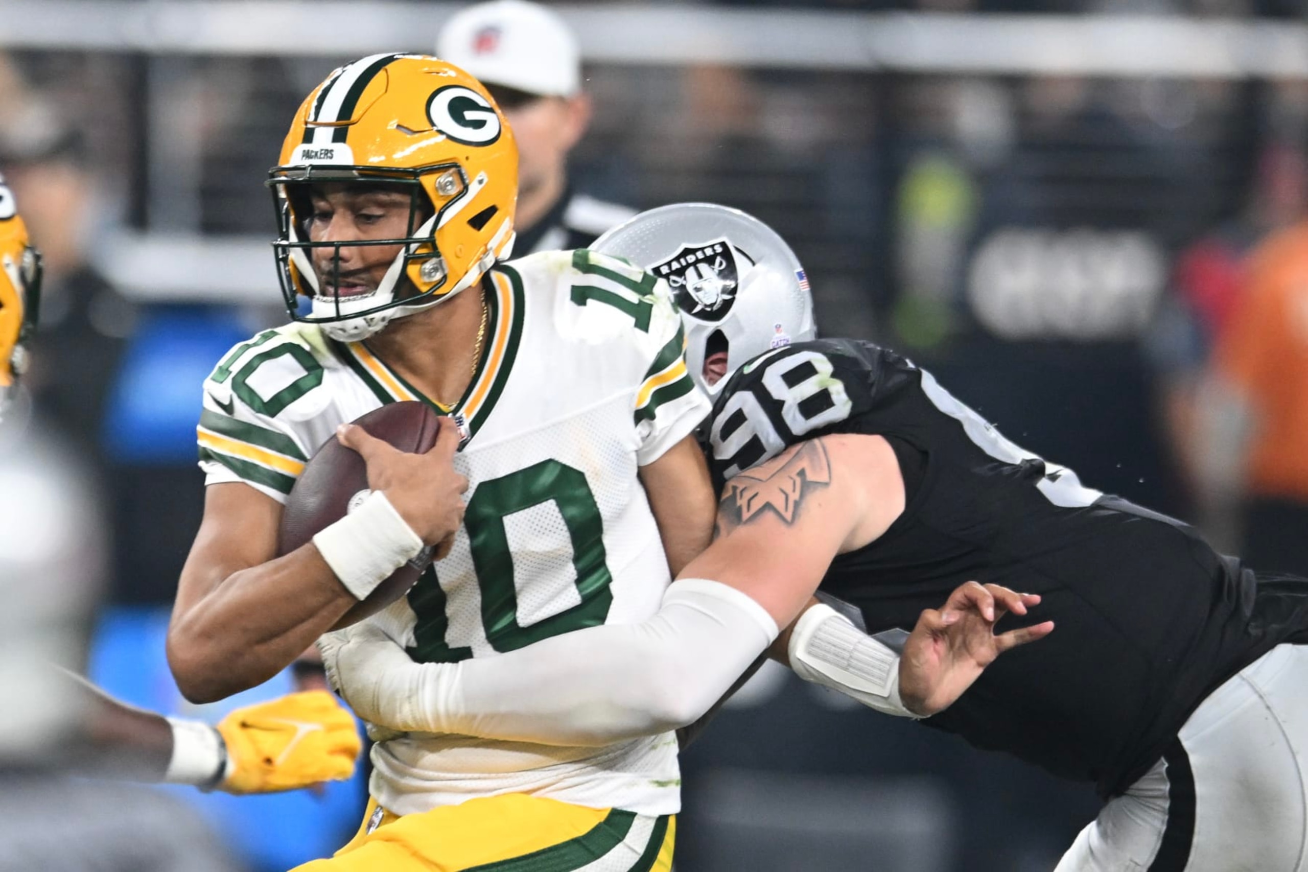 LAS VEGAS, NEVADA - OCTOBER 09: Jordan Love #10 of the Green Bay Packers is sacked by Maxx Crosby #98 of the Las Vegas Raiders in the fourth quarter at Allegiant Stadium on October 09, 2023 in Las Vegas, Nevada. The Raiders defeated the Packers 17-13. (Photo by Candice Ward/Getty Images) LAS VEGAS, NEVADA - OCTOBER 09: Jordan Love #10 of the Green Bay Packers is sacked by Maxx Crosby #98 of the Las Vegas Raiders in the fourth quarter at Allegiant Stadium on October 09, 2023 in Las Vegas, Nevada. The Raiders defeated the Packers 17-13. (Photo by Candice Ward/Getty Images)