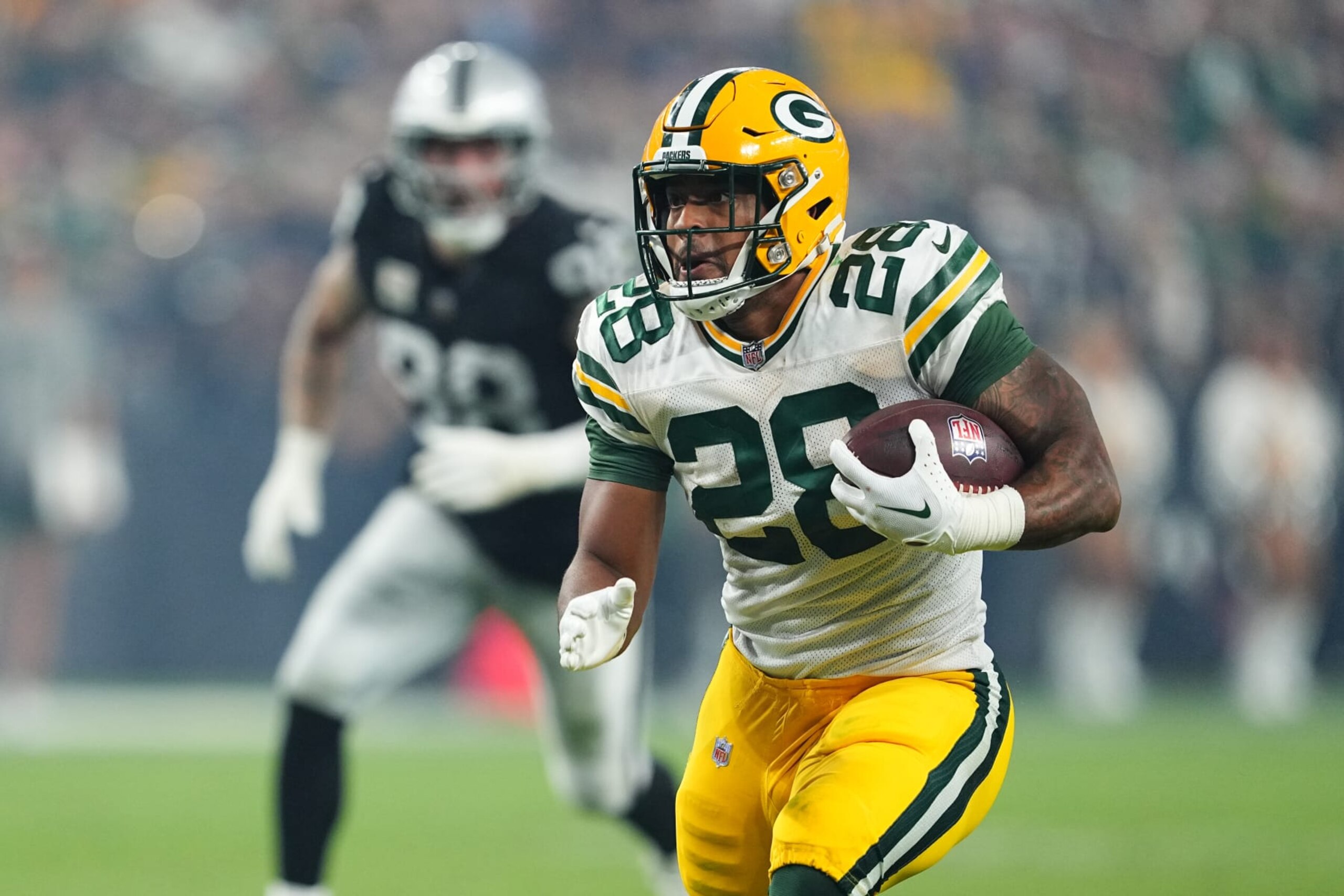 LAS VEGAS, NEVADA - OCTOBER 09: Running back AJ Dillon #28 of the Green Bay Packers runs against the Las Vegas Raiders during the second half of a game at Allegiant Stadium on October 09, 2023 in Las Vegas, Nevada. (Photo by Chris Unger/Getty Images) LAS VEGAS, NEVADA - OCTOBER 09: Running back AJ Dillon #28 of the Green Bay Packers runs against the Las Vegas Raiders during the second half of a game at Allegiant Stadium on October 09, 2023 in Las Vegas, Nevada. (Photo by Chris Unger/Getty Images)
