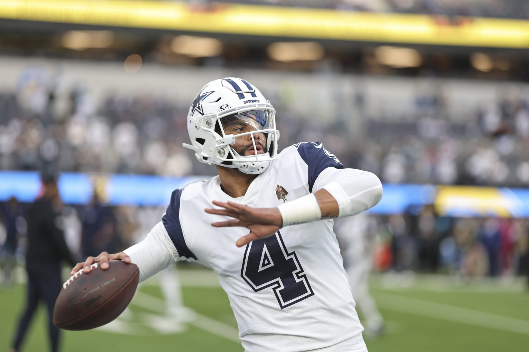 INGLEWOOD, CALIFORNIA - OCTOBER 16: Dak Prescott #4 of the Dallas Cowboys passes as he warms up prior to an NFL football game between the Los Angeles Chargers and the Dallas Cowboys at SoFi Stadium on October 16, 2023 in Inglewood, California. (Photo by Michael Owens/Getty Images)