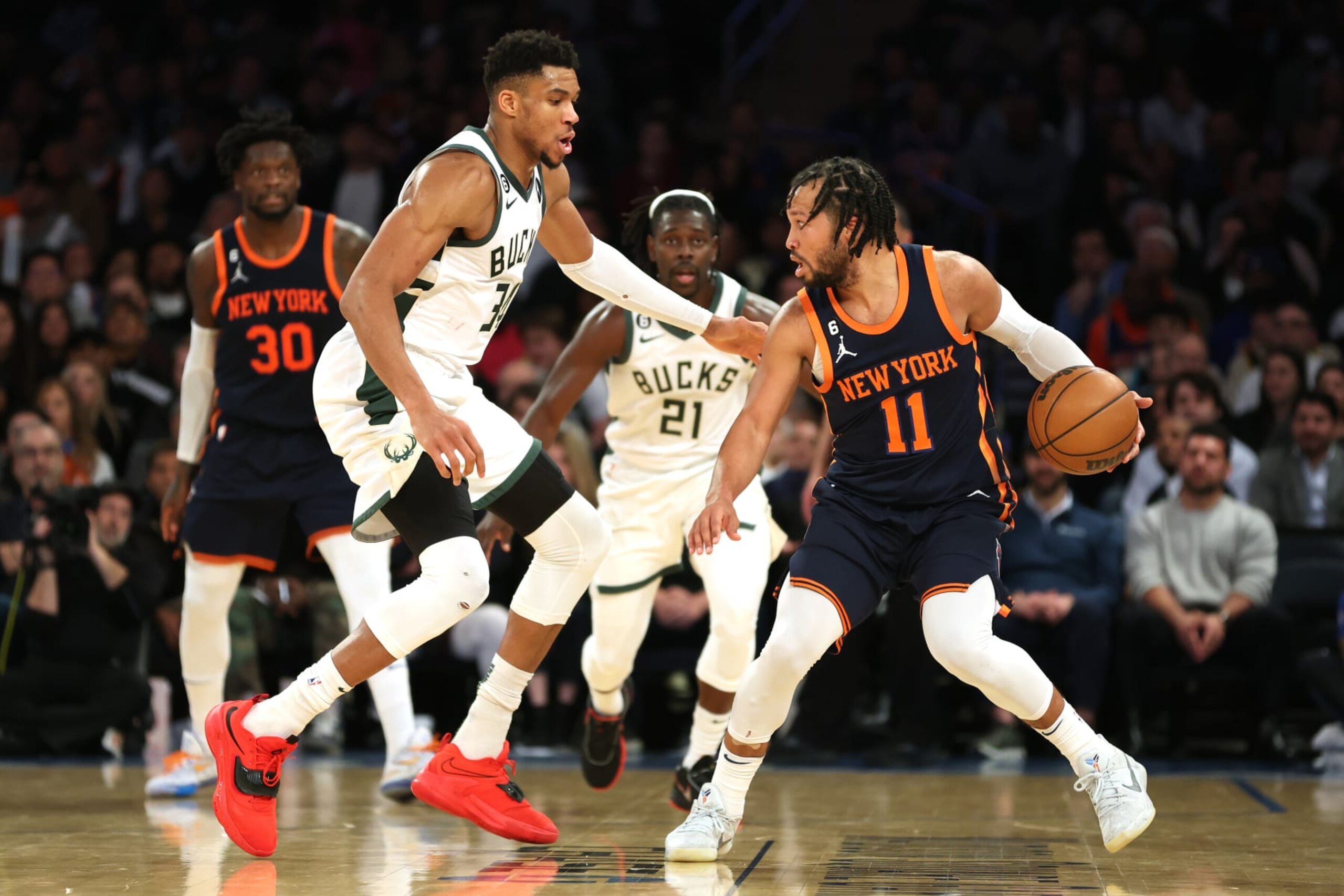 NEW YORK, NEW YORK - JANUARY 09: Jalen Brunson #11 of the New York Knicks dribbles against Giannis Antetokounmpo #34 of the Milwaukee Bucks during the second half at Madison Square Garden on January 09, 2023 in New York City. The Bucks won 111-107. NOTE TO USER: User expressly acknowledges and agrees that, by downloading and/or using this photograph, User is consenting to the terms and conditions of the Getty Images License Agreement. (Photo by Sarah Stier/Getty Images)