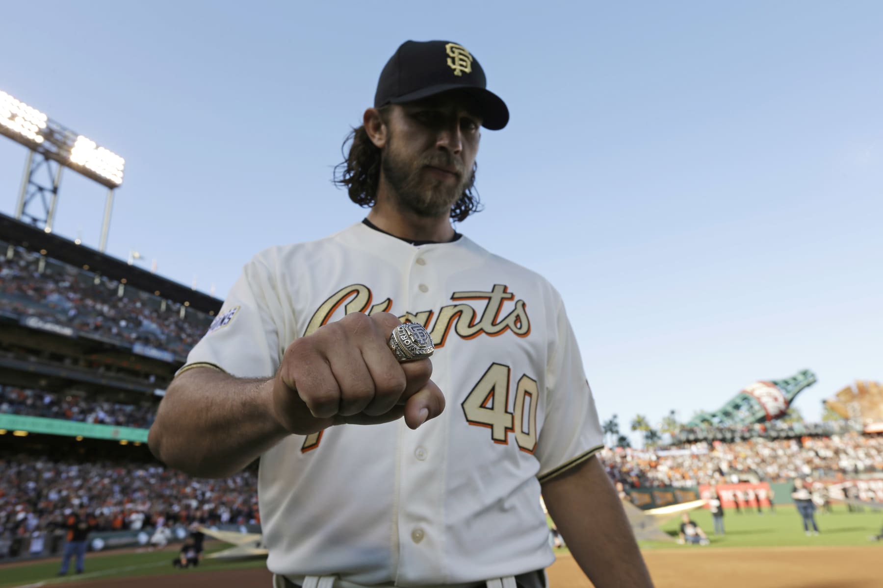SAN FRANCISCO, CA - APRIL 18:  Madison Bumgarner #40 of the San Francisco Giants displays his World Series ring during the San Francisco Giants 2014 World Series Ring ceremony before the game against the Arizona Diamondbacks at AT&T Park on April 18, 2015 in San Francisco, California.  (Photo by Ben Margot - Pool/Getty Images)