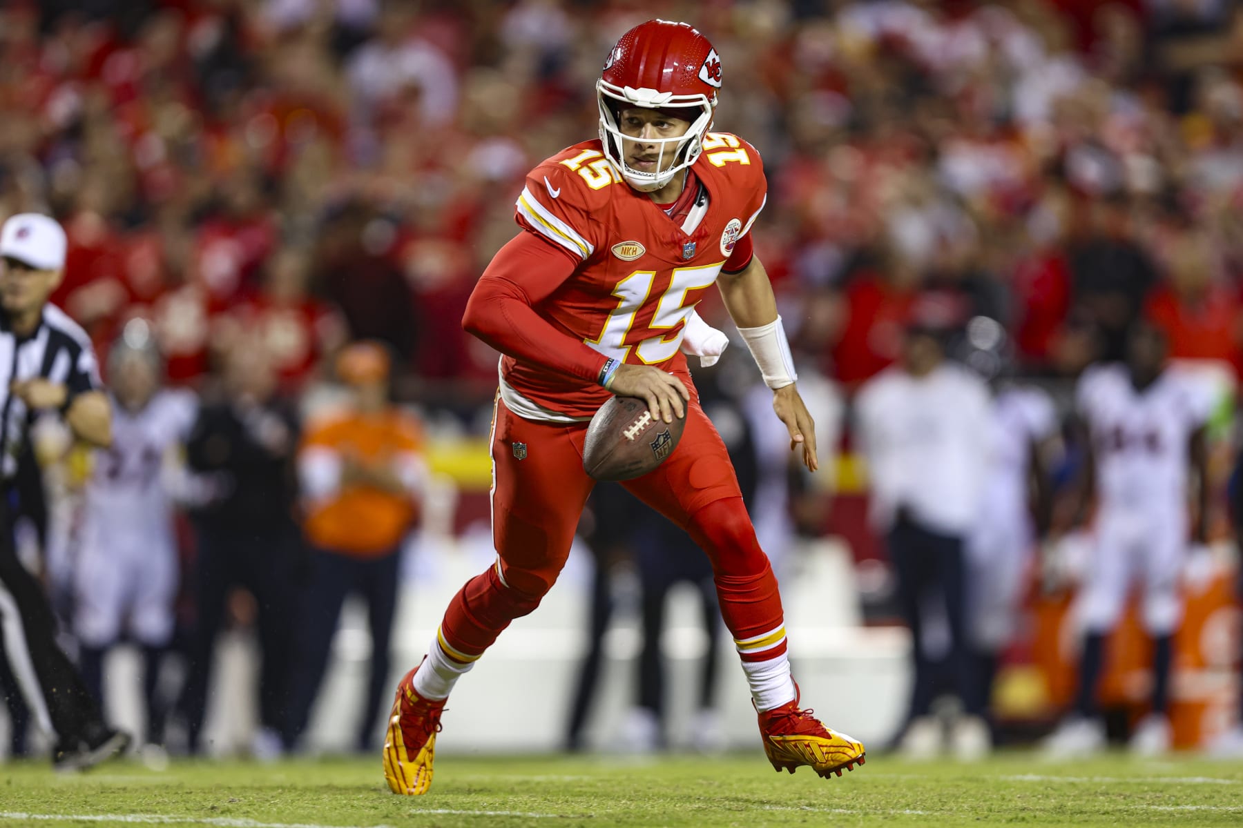 KANSAS CITY, MO - OCTOBER 12: Patrick Mahomes #15 of the Kansas City Chiefs scrambles out of the pocket during an NFL football game against the Denver Broncos at GEHA Field at Arrowhead Stadium on October 12, 2023 in Kansas City, Missouri. (Photo by Perry Knotts/Getty Images)
