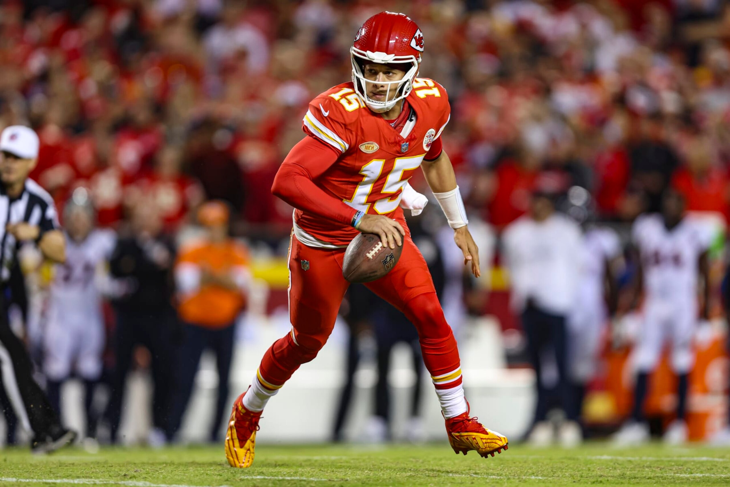 KANSAS CITY, MO - OCTOBER 12: Patrick Mahomes #15 of the Kansas City Chiefs scrambles out of the pocket during an NFL football game against the Denver Broncos at GEHA Field at Arrowhead Stadium on October 12, 2023 in Kansas City, Missouri. (Photo by Perry Knotts/Getty Images)