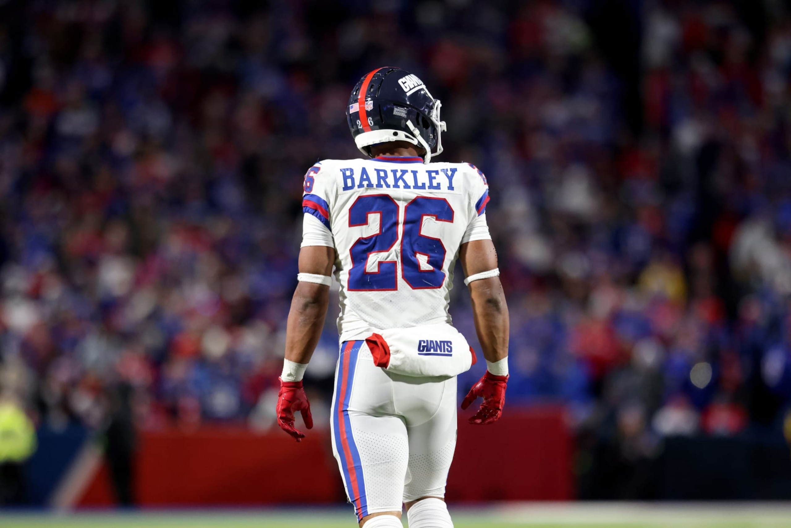ORCHARD PARK, NEW YORK - OCTOBER 15: Saquon Barkley #26 of the New York Giants looks on during the fourth quarter against the Buffalo Bills at Highmark Stadium on October 15, 2023 in Orchard Park, New York. (Photo by Bryan Bennett/Getty Images) ORCHARD PARK, NEW YORK - OCTOBER 15: Saquon Barkley #26 of the New York Giants looks on during the fourth quarter against the Buffalo Bills at Highmark Stadium on October 15, 2023 in Orchard Park, New York. (Photo by Bryan Bennett/Getty Images)