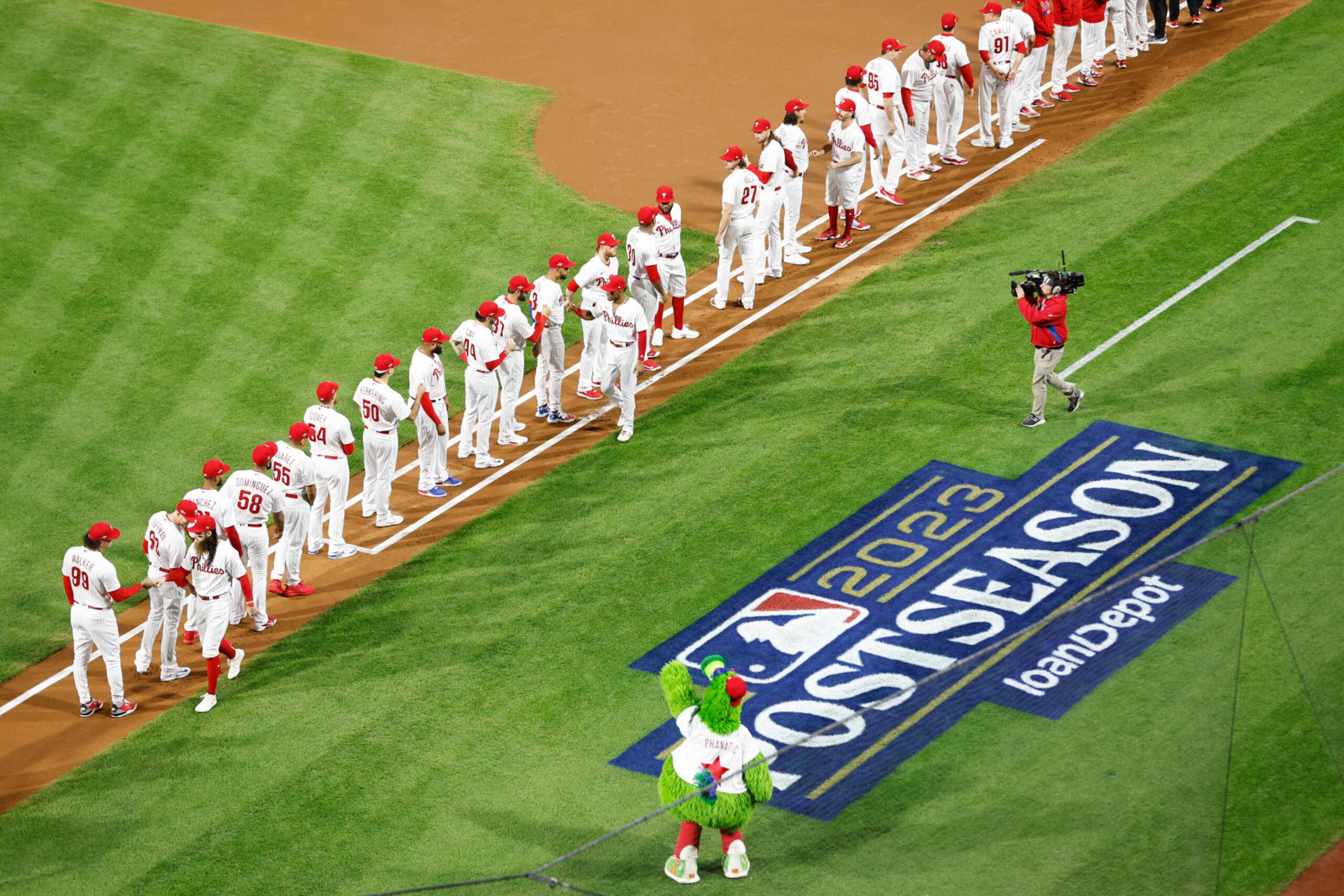 PHILADELPHIA, PA - OCTOBER 16: Members of the Philadelphia Phillies line up on the field prior to Game 1 of the NLCS between the Arizona Diamondbacks and the Philadelphia Phillies at Citizens Bank Park on Monday, October 16, 2023 in Philadelphia, Pennsylvania. (Photo by Brian Garfinkel/MLB Photos via Getty Images) PHILADELPHIA, PA - OCTOBER 16: Members of the Philadelphia Phillies line up on the field prior to Game 1 of the NLCS between the Arizona Diamondbacks and the Philadelphia Phillies at Citizens Bank Park on Monday, October 16, 2023 in Philadelphia, Pennsylvania. (Photo by Brian Garfinkel/MLB Photos via Getty Images)
