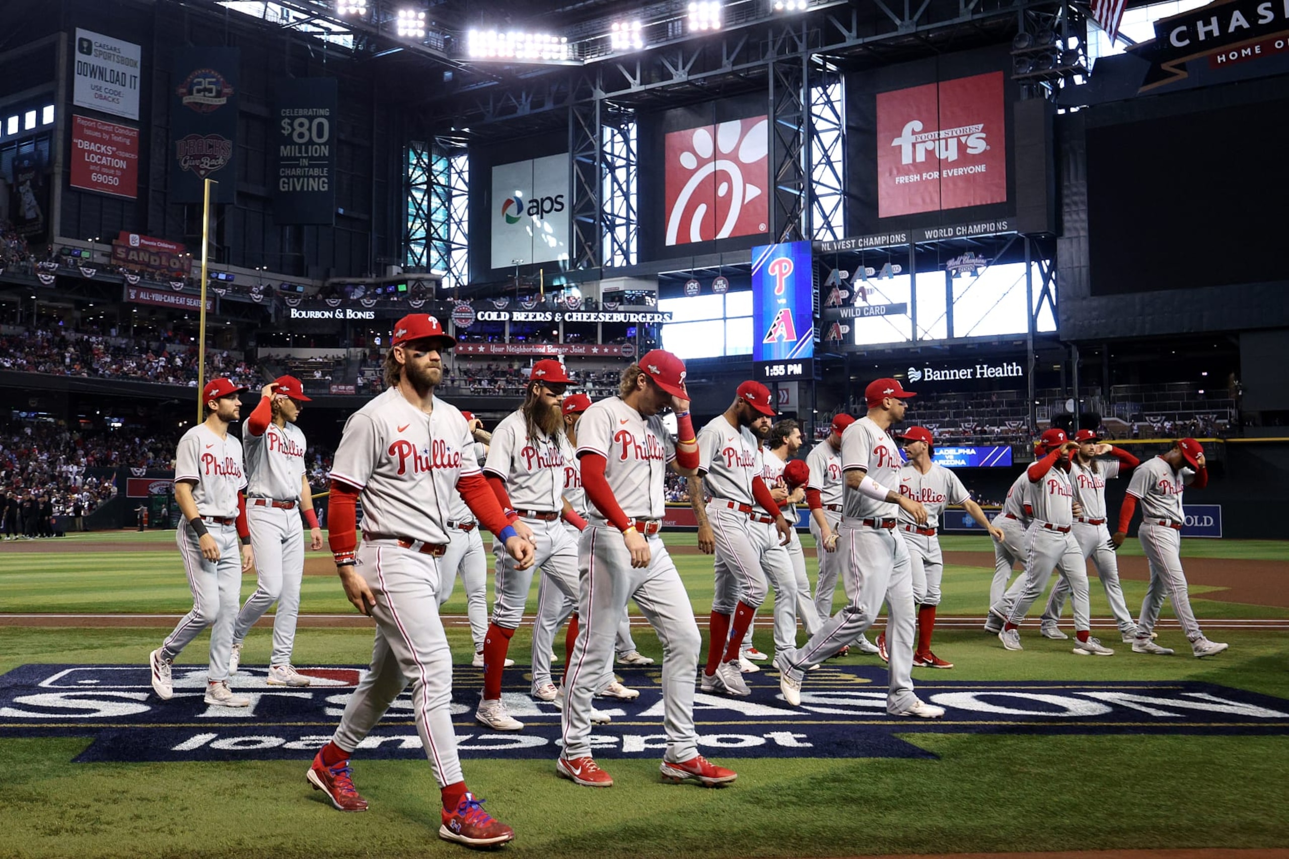 PHOENIX, ARIZONA - OCTOBER 19: Bryce Harper #3 of the Philadelphia Phillies walks to the dugout with his teammates prior to Game Three of the National League Championship Series against the Arizona Diamondbacks at Chase Field on October 19, 2023 in Phoenix, Arizona. (Photo by Harry How/Getty Images) PHOENIX, ARIZONA - OCTOBER 19: Bryce Harper #3 of the Philadelphia Phillies walks to the dugout with his teammates prior to Game Three of the National League Championship Series against the Arizona Diamondbacks at Chase Field on October 19, 2023 in Phoenix, Arizona. (Photo by Harry How/Getty Images)