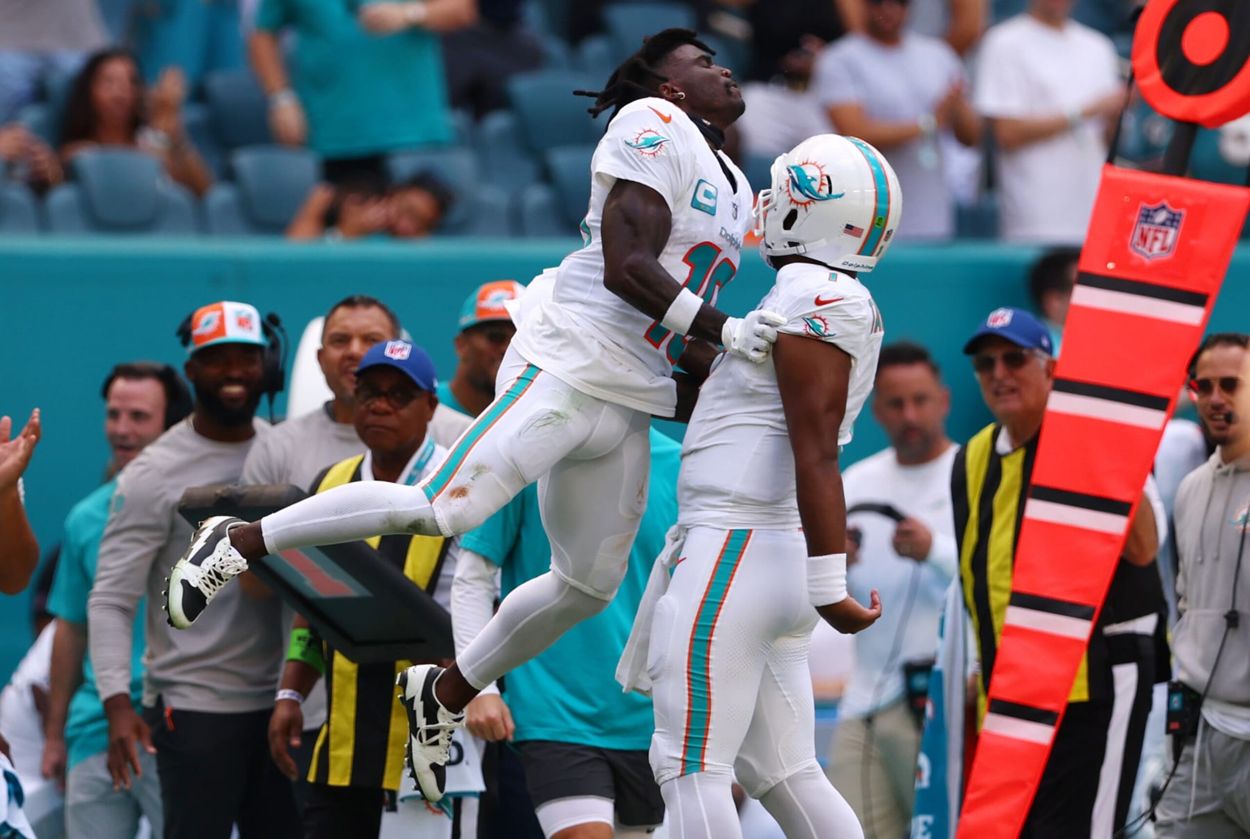 MIAMI GARDENS, FLORIDA - OCTOBER 15: Tyreek Hill #10 of the Miami Dolphins celebrates a touchdown with Tua Tagovailoa #1 during the second quarter in the game against the Carolina Panthers at Hard Rock Stadium on October 15, 2023 in Miami Gardens, Florida. (Photo by Megan Briggs/Getty Images)