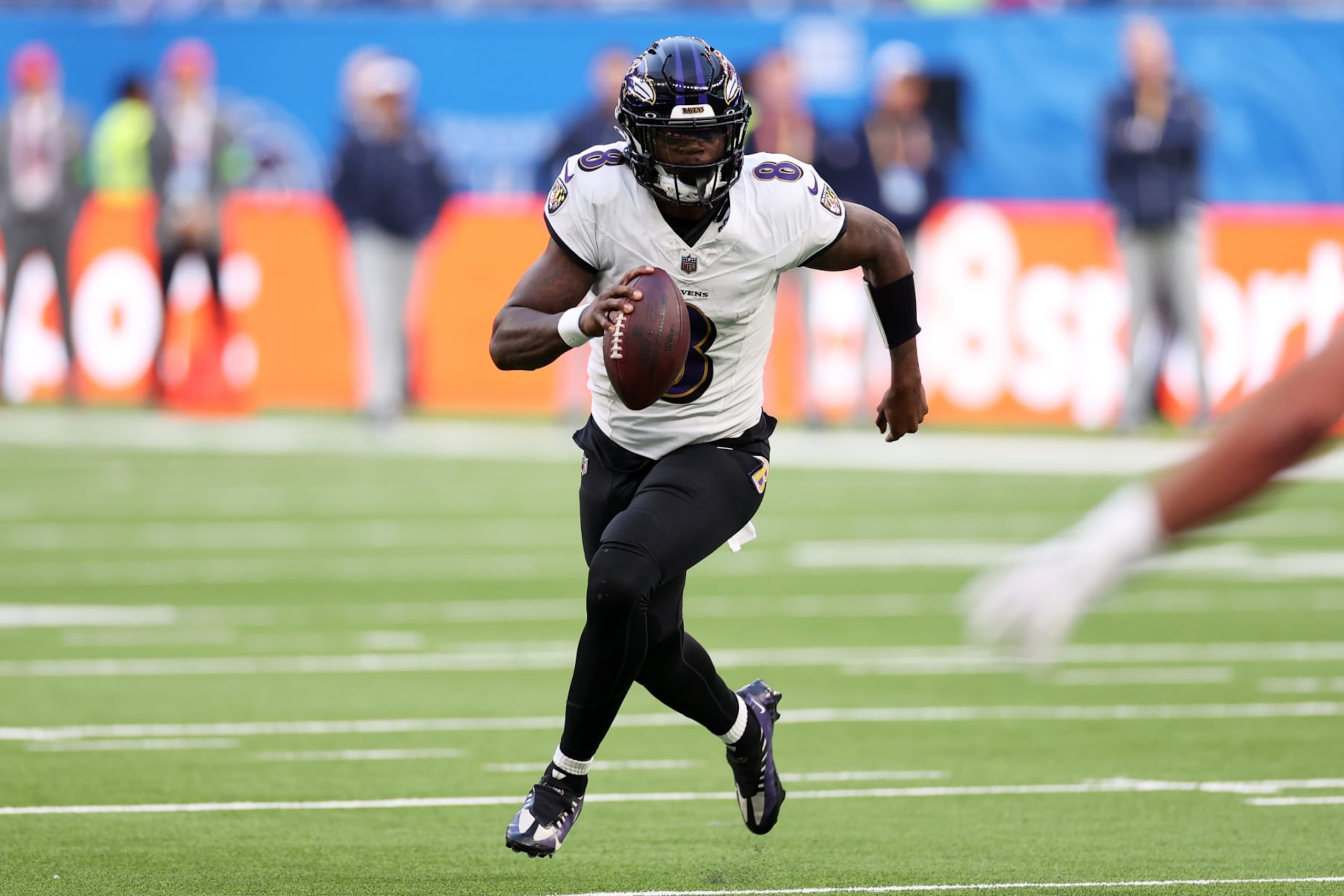 LONDON, ENGLAND - OCTOBER 15: Lamar Jackson #8 of the Baltimore Ravens looks to pass in the third quarter during the 2023 NFL London Games match between Baltimore Ravens and Tennessee Titans at Tottenham Hotspur Stadium on October 15, 2023 in London, England. (Photo by Ryan Pierse/Getty Images)