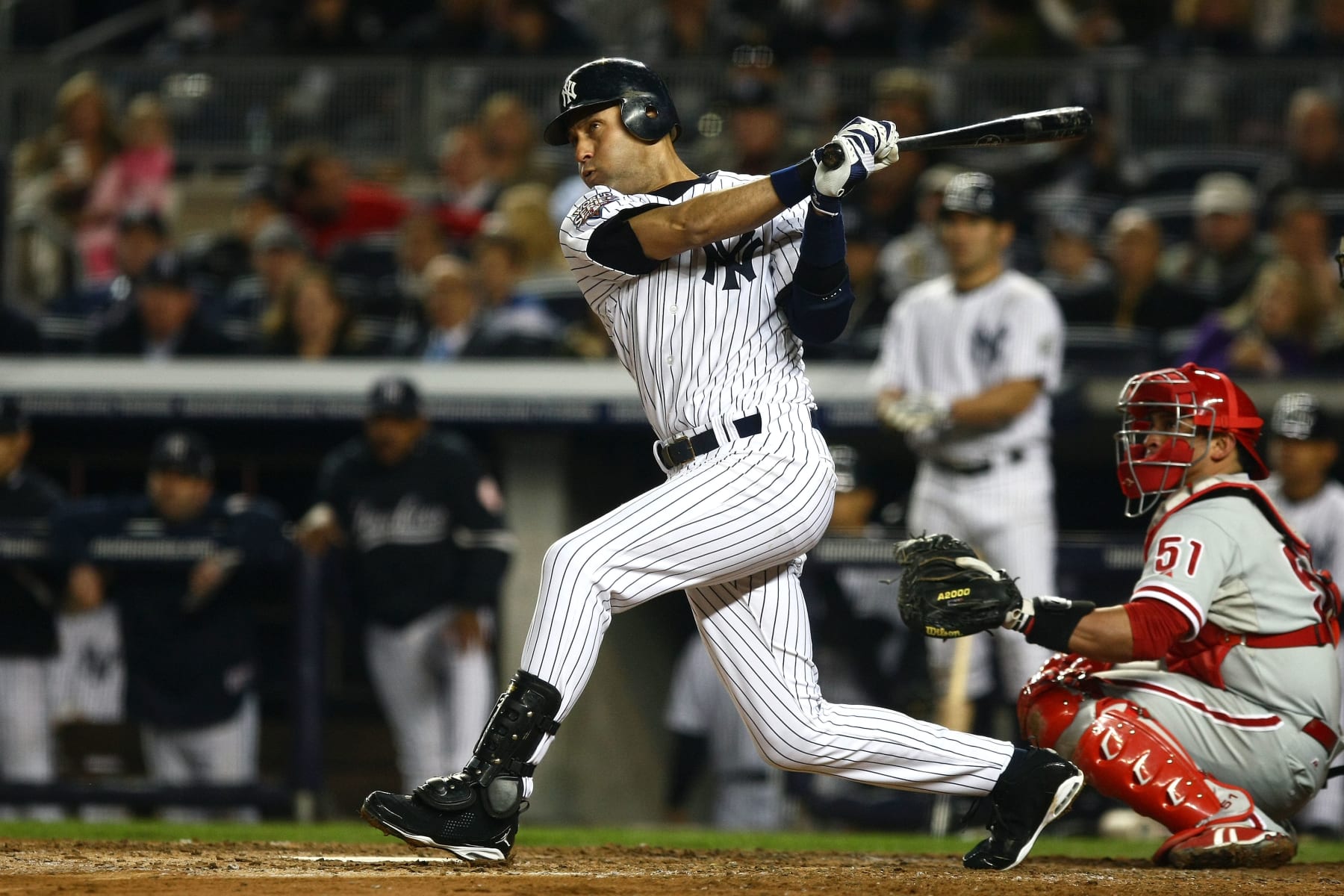 NEW YORK - OCTOBER 29:  Derek Jeter #2 of the New York Yankees hits a double against the Philadelphia Phillies in Game Two of the 2009 MLB World Series at Yankee Stadium on October 29, 2009 in the Bronx borough of New York City.  (Photo by Chris McGrath/Getty Images)