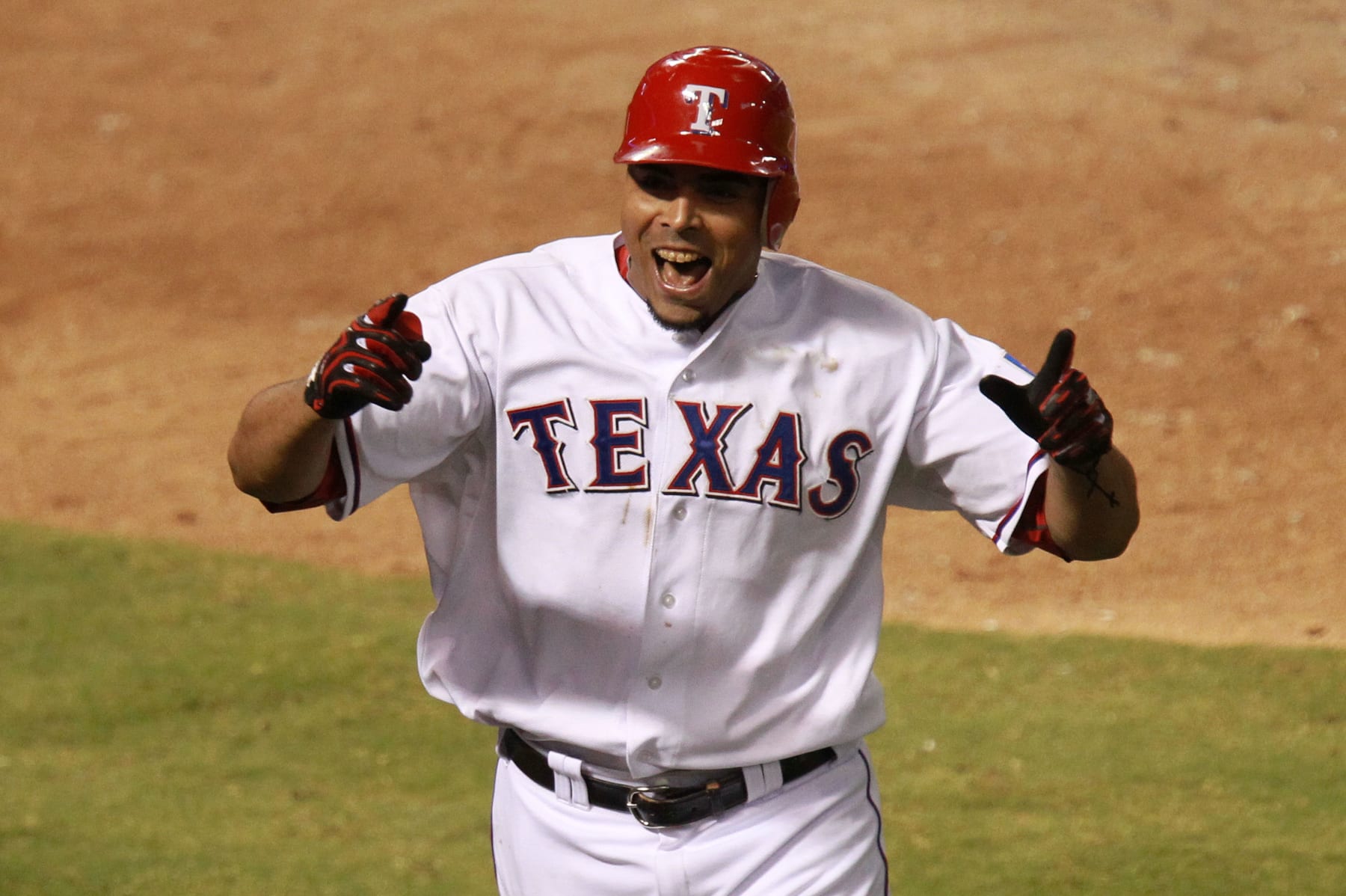 ARLINGTON, TX - OCTOBER 15:  Nelson Cruz #17 of the Texas Rangers celebrates after hitting a two-run home run in the seventh inning of Game Six of the American League Championship Series against the Detroit Tigers at Rangers Ballpark in Arlington on October 15, 2011 in Arlington, Texas.  (Photo by Ronald Martinez/Getty Images)