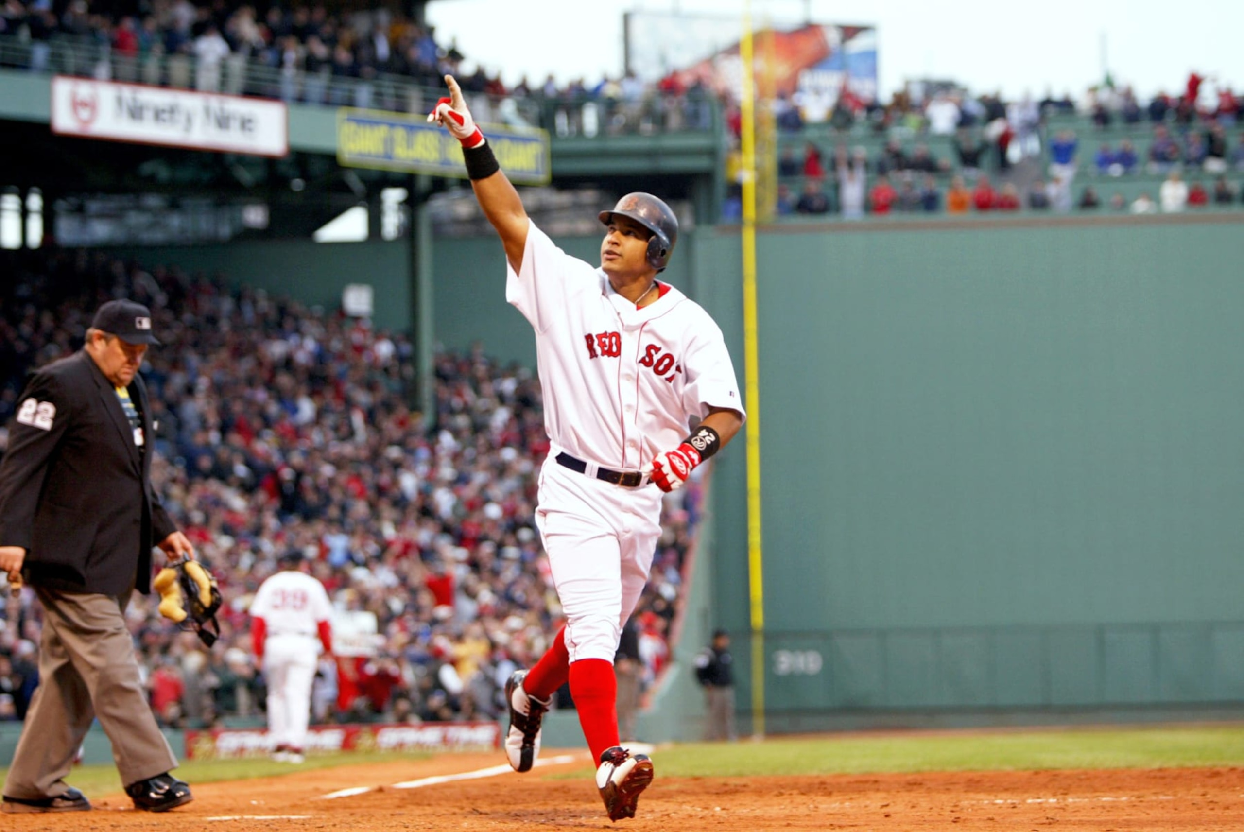 BOSTON, MA - OCTOBER 13:  Manny Ramirez #24 of the Boston Red Sox points to the crowd after scoring a run against the New York Yankees at on October 13, 2003 at Fenway Park in Boston, Massachusetts.  The Yankees defeated the Red Sox in Game 5 of the 2003 ALCS 4 - 2.  The Yankees won the 2003 ALCS against the Red Sox 4 games to 3. (Photo by Allen Kee/WireImage)