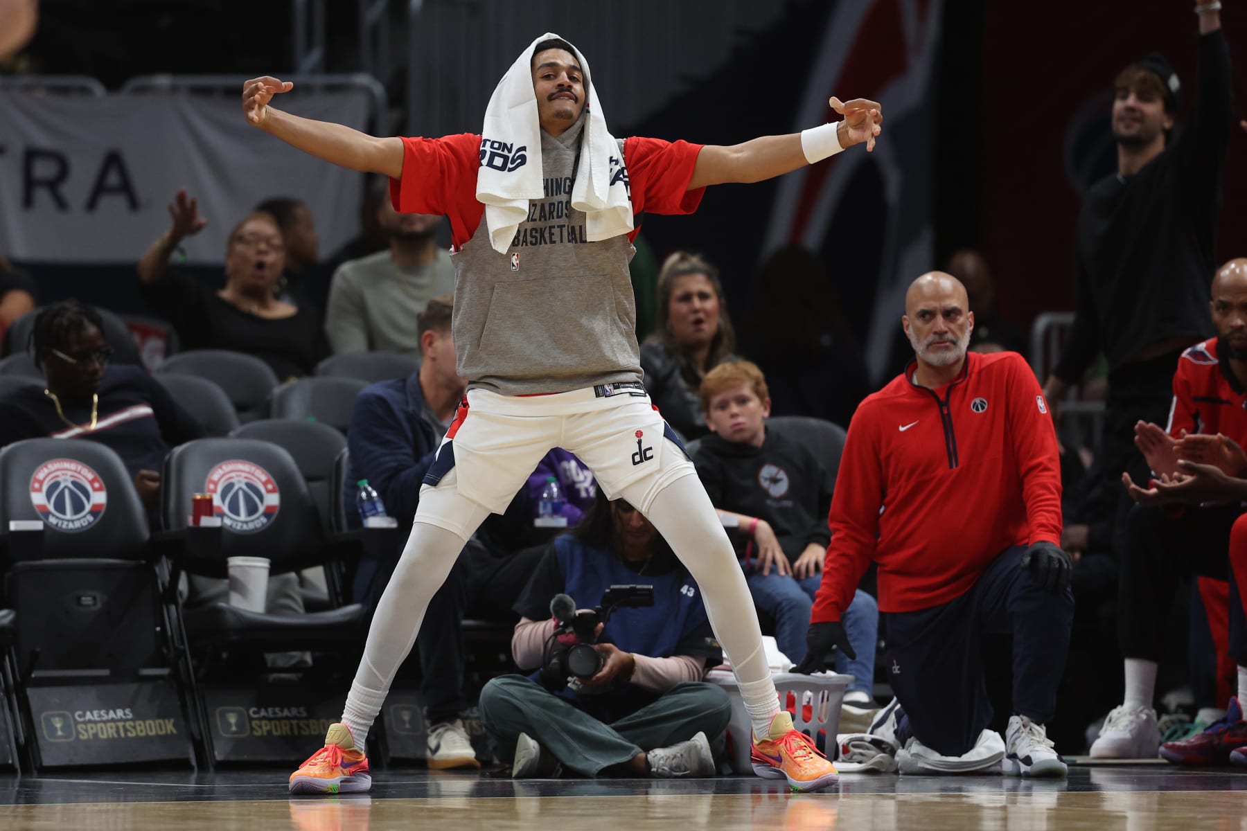 WASHINGTON, DC - OCTOBER 10: Jordan Poole #13 of the Washington Wizards celebrates a teammate's three point basket against the Cairns Taipans during the second half of a preseason game at Capital One Arena on October 10, 2023 in Washington, DC. NOTE TO USER: User expressly acknowledges and agrees that, by downloading and or using this photograph, User is consenting to the terms and conditions of the Getty Images License Agreement.  (Photo by Patrick Smith/Getty Images)