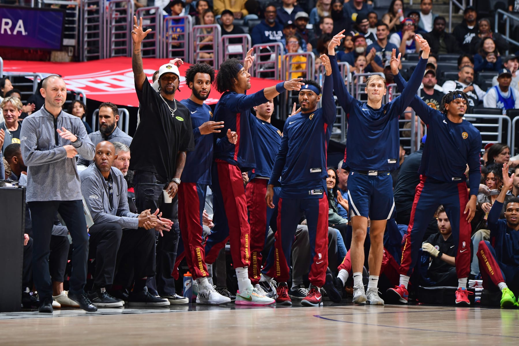 LOS ANGELES, CA - OCTOBER 17: Denver Nuggets bench celebrates during the game against the LA Clippers on October 17, 2023 at Crypto.Com Arena in Los Angeles, California. NOTE TO USER: User expressly acknowledges and agrees that, by downloading and/or using this Photograph, user is consenting to the terms and conditions of the Getty Images License Agreement. Mandatory Copyright Notice: Copyright 2023 NBAE (Photo by Adam Pantozzi/NBAE via Getty Images)