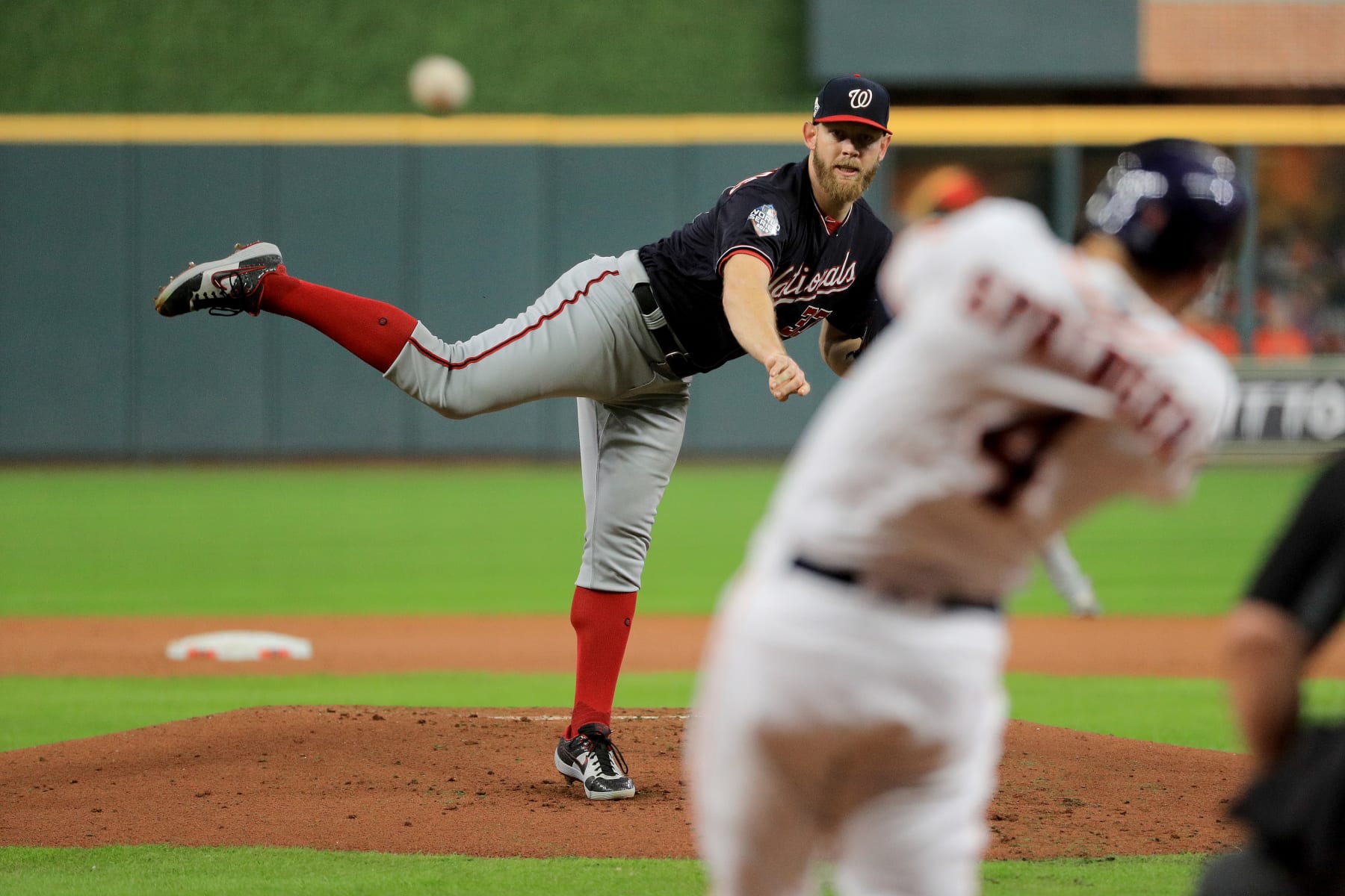 HOUSTON, TEXAS - OCTOBER 29:  Stephen Strasburg #37 of the Washington Nationals delivers the pitch to George Springer #4 of the Houston Astros who hits a leadoff double during the first inning in Game Six of the 2019 World Series at Minute Maid Park on October 29, 2019 in Houston, Texas. (Photo by Mike Ehrmann/Getty Images)
