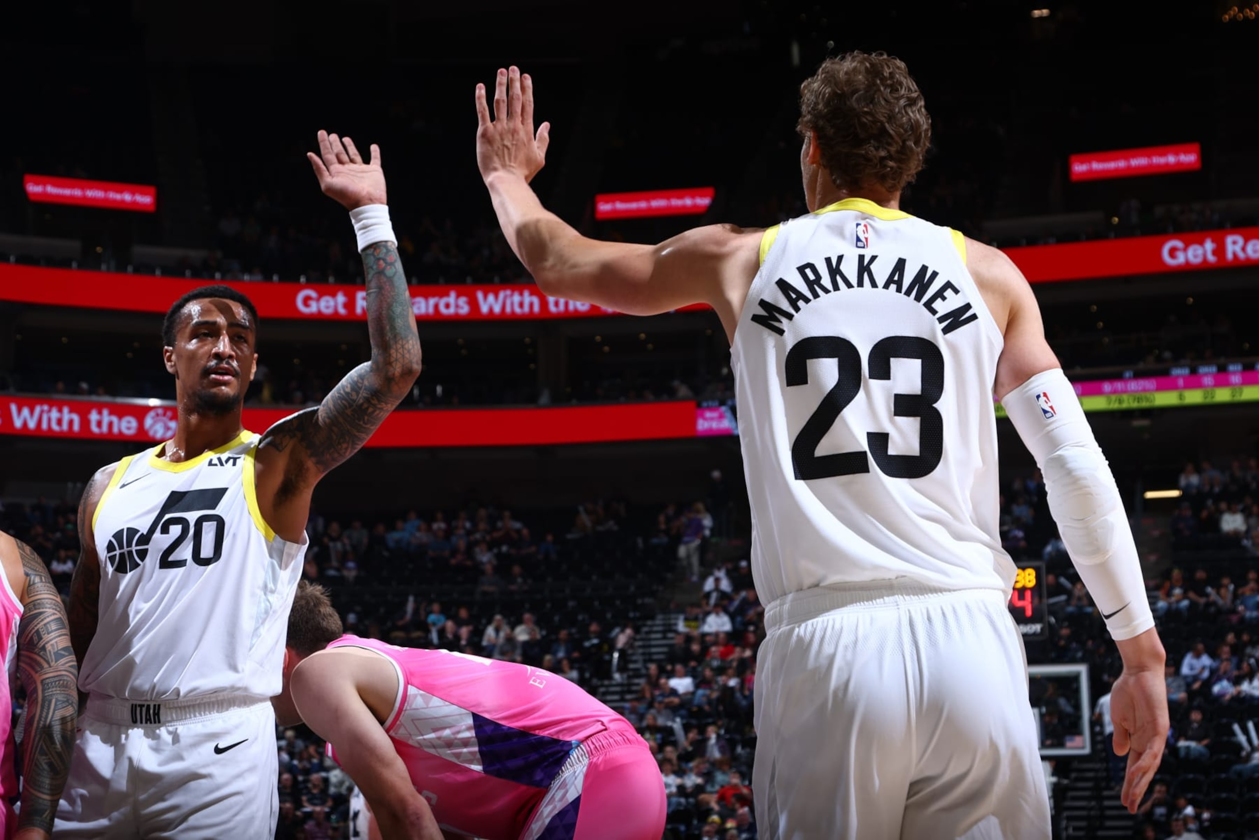 SALT LAKE CITY, UT - OCTOBER 16: Lauri Markkanen #23 high fives John Collins #20 of the Utah Jazz during the preseason game on October 16, 2023 at vivint.SmartHome Arena in Salt Lake City, Utah. NOTE TO USER: User expressly acknowledges and agrees that, by downloading and or using this Photograph, User is consenting to the terms and conditions of the Getty Images License Agreement. Mandatory Copyright Notice: Copyright 2023 NBAE (Photo by Melissa Majchrzak/NBAE via Getty Images)