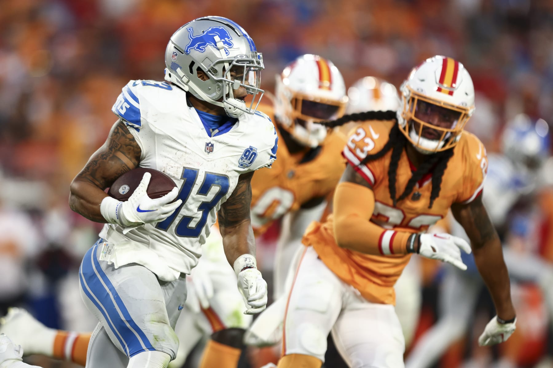 TAMPA, FL - OCTOBER 15: Craig Reynolds #13 of the Detroit Lions carries the ball during the fourth quarter of an NFL football game against the Tampa Bay Buccaneers at Raymond James Stadium on October 15, 2023 in Tampa, Florida. (Photo by Kevin Sabitus/Getty Images)