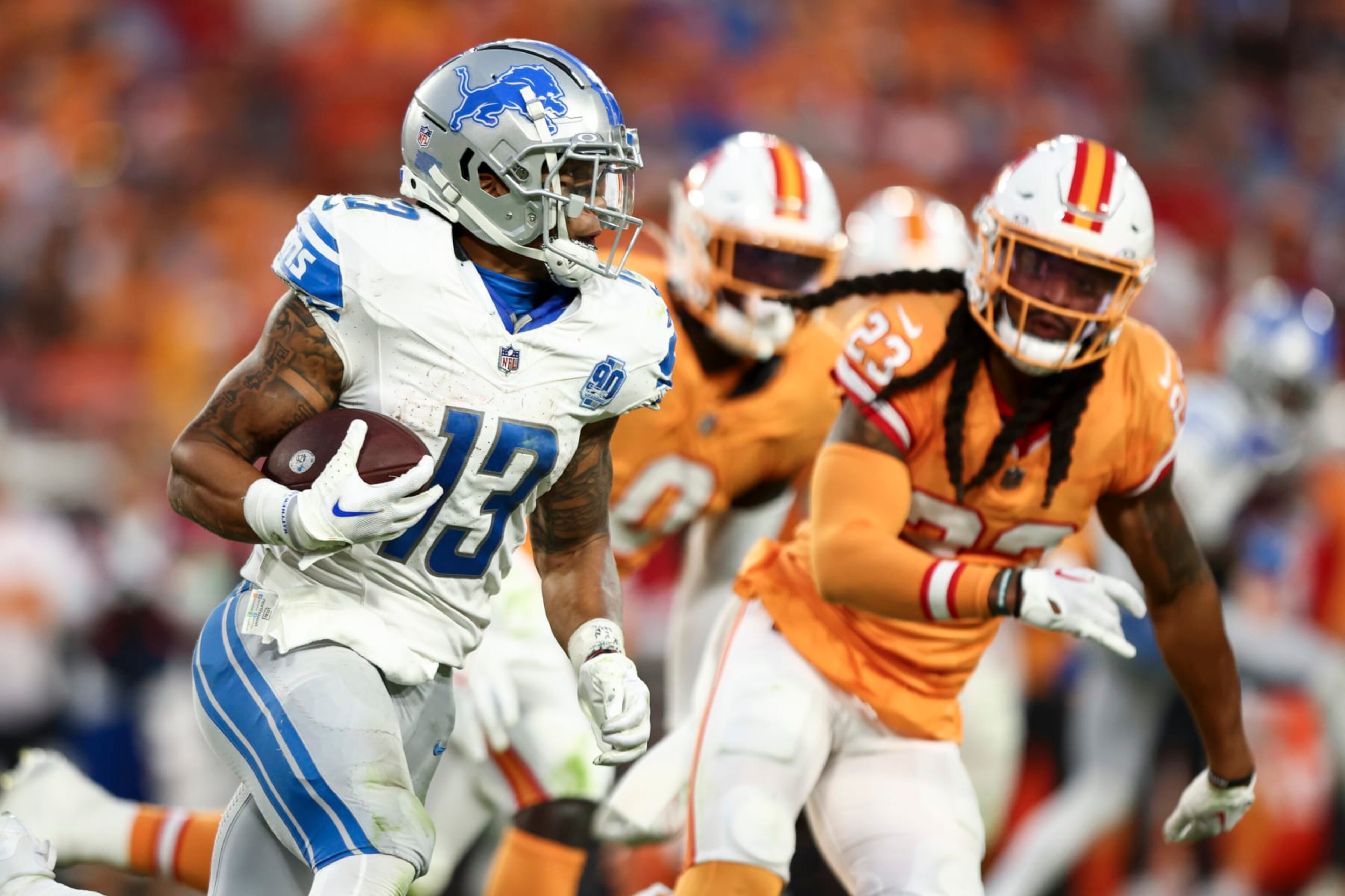 TAMPA, FL - OCTOBER 15: Craig Reynolds #13 of the Detroit Lions carries the ball during the fourth quarter of an NFL football game against the Tampa Bay Buccaneers at Raymond James Stadium on October 15, 2023 in Tampa, Florida. (Photo by Kevin Sabitus/Getty Images)