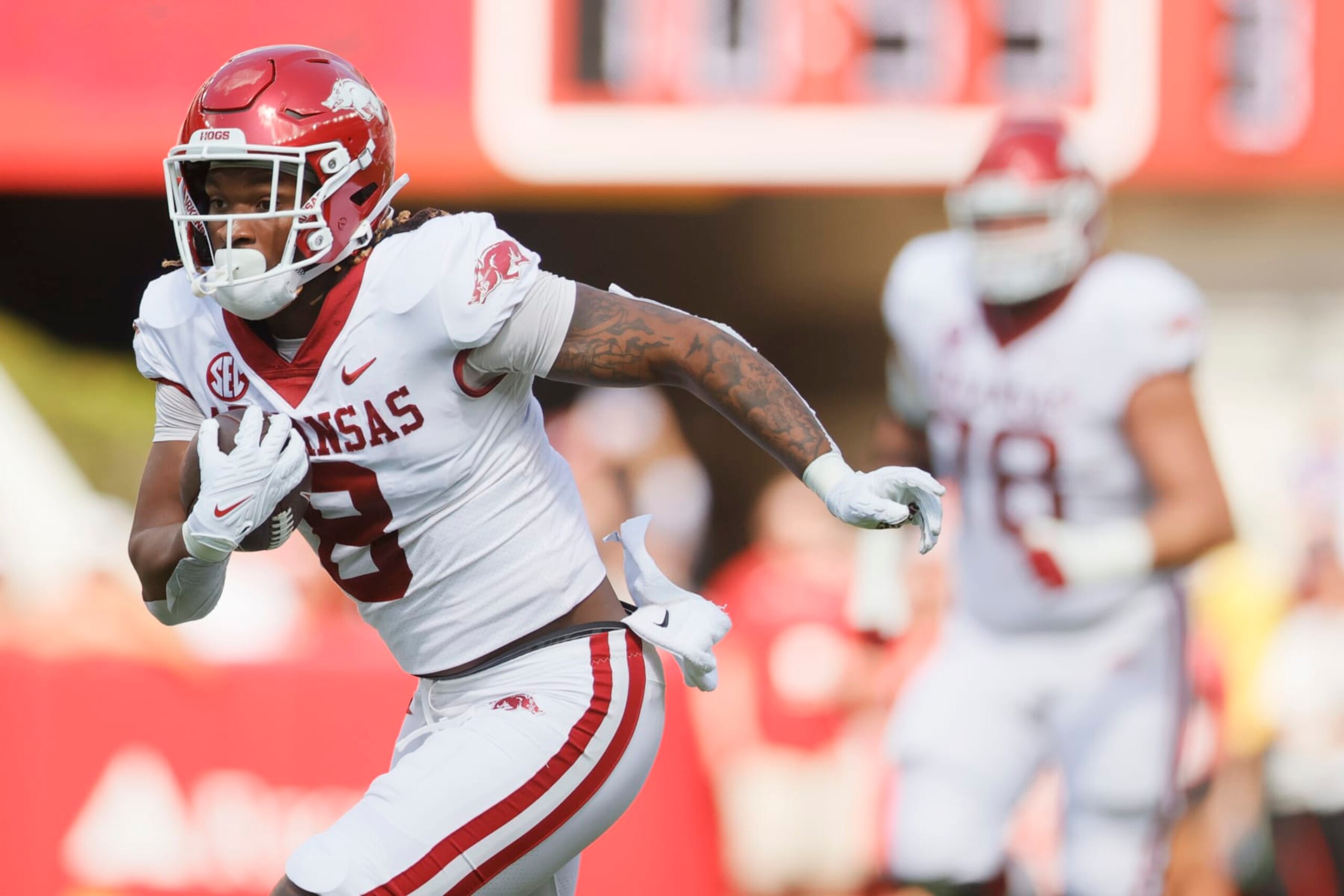 TUSCALOOSA, ALABAMA - OCTOBER 14: Ty Washington #8 of the Arkansas Razorbacks runs the ball against the Alabama Crimson Tide during the first quarter at Bryant-Denny Stadium on October 14, 2023 in Tuscaloosa, Alabama. (Photo by Alex Slitz/Getty Images)