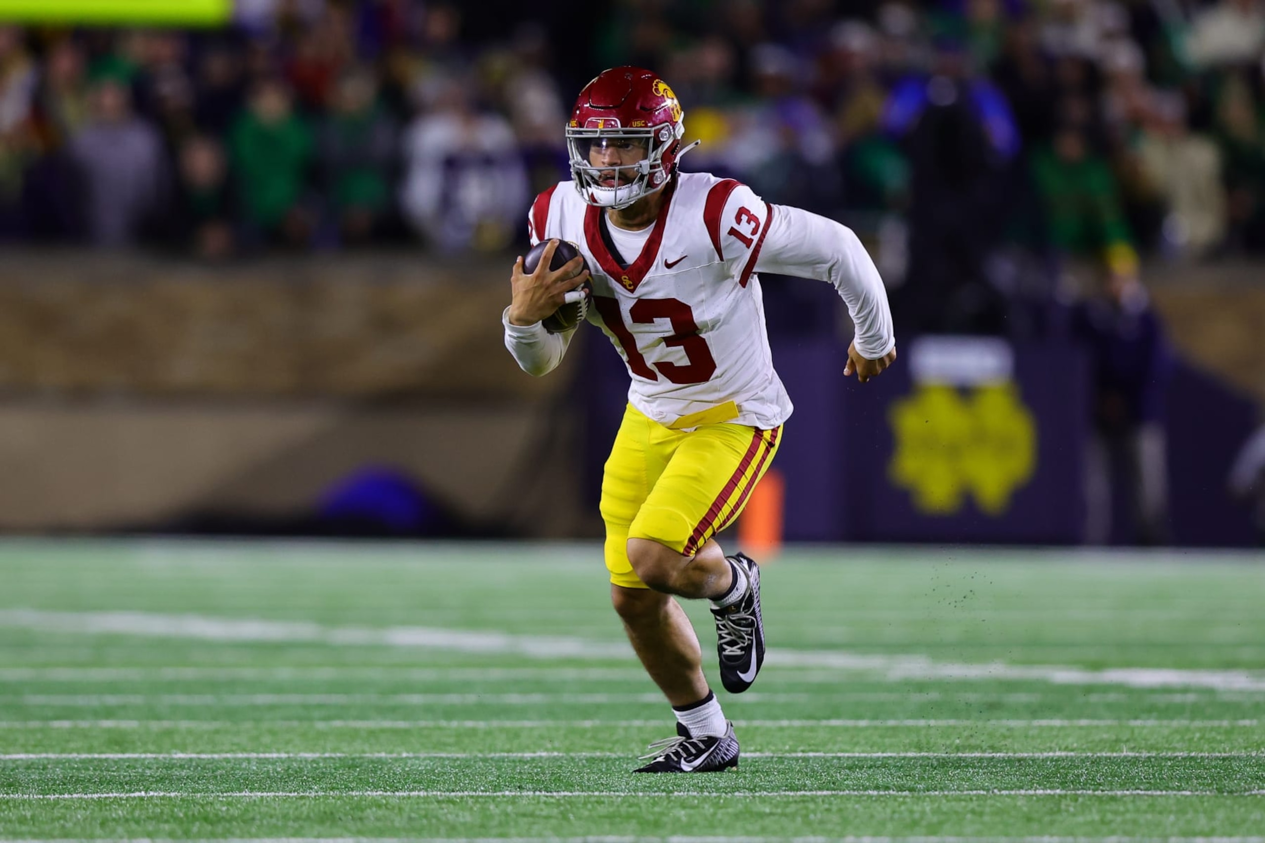 SOUTH BEND, IN - OCTOBER 14: USC Trojans quarterback Caleb Williams (13) runs the ball out of the pocket during the college football game between the USC Trojans  and Notre Dame Fighting Irish on October 14, 2023, at Notre Dame Stadium in South Bend, IN. (Photo by Jordon Kelly/Icon Sportswire via Getty Images)